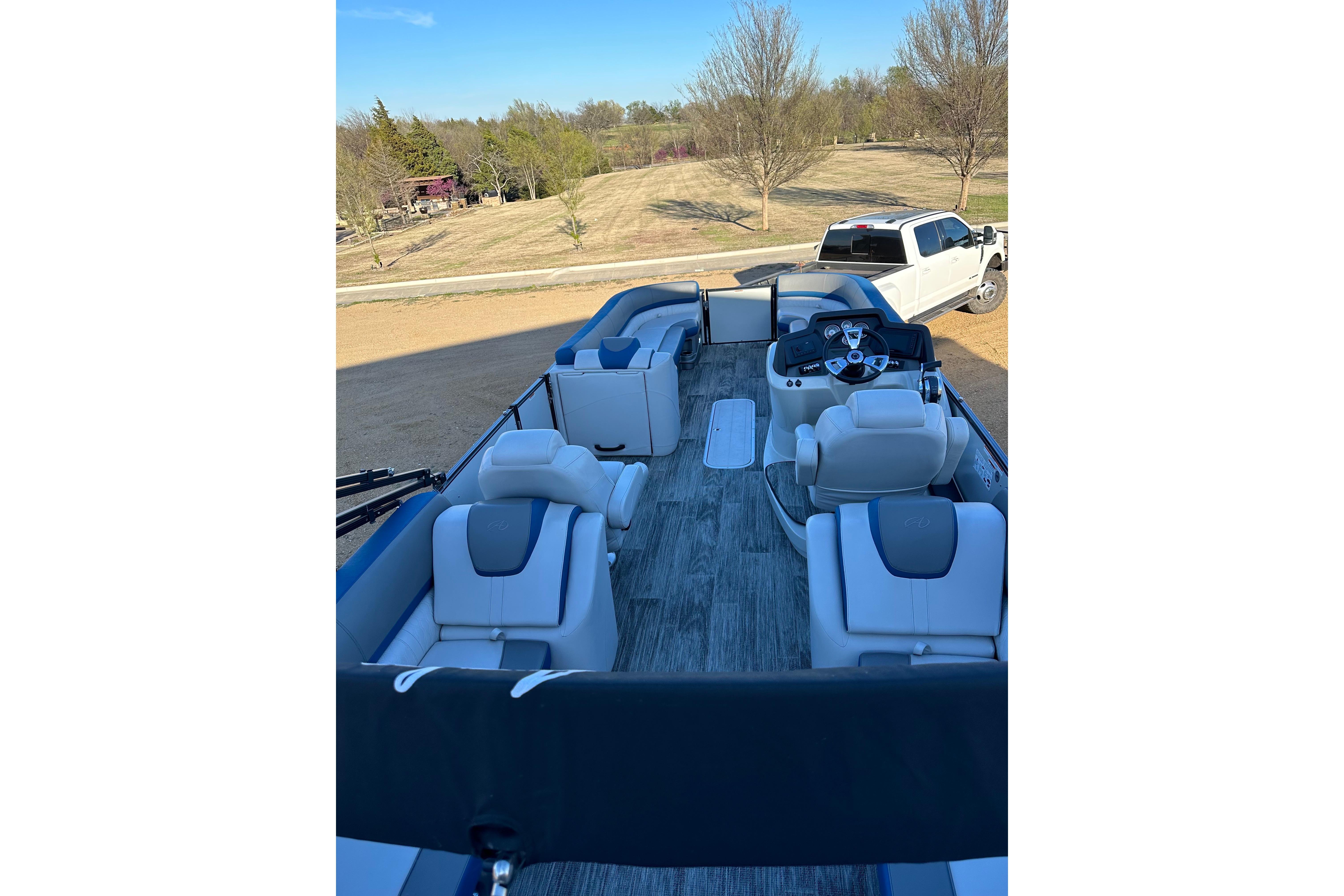 2022 Avalon Catalina 2785 pontoon boat with luxurious seating and modern dashboard.