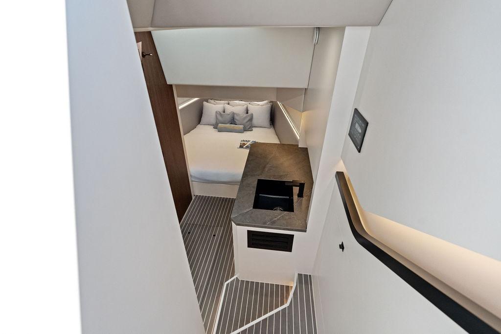 Luxurious interior of 2024 Vanquish Yachts VQ55, featuring modern design and cozy sleeping area.