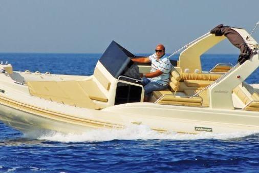 2012 Solemar 23 boat cruising on open water with a person at the helm.