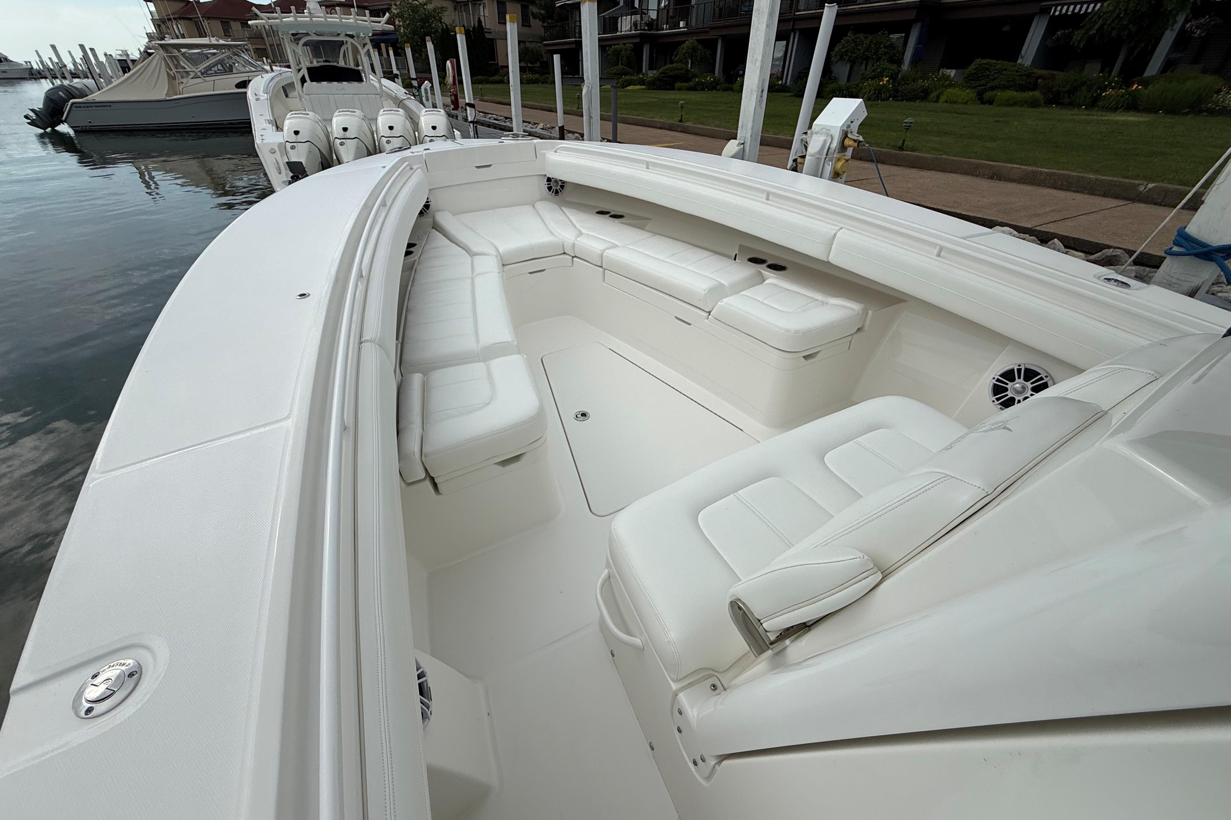 2021 Regulator 31 boat with spacious white seating and sleek design at a dock.