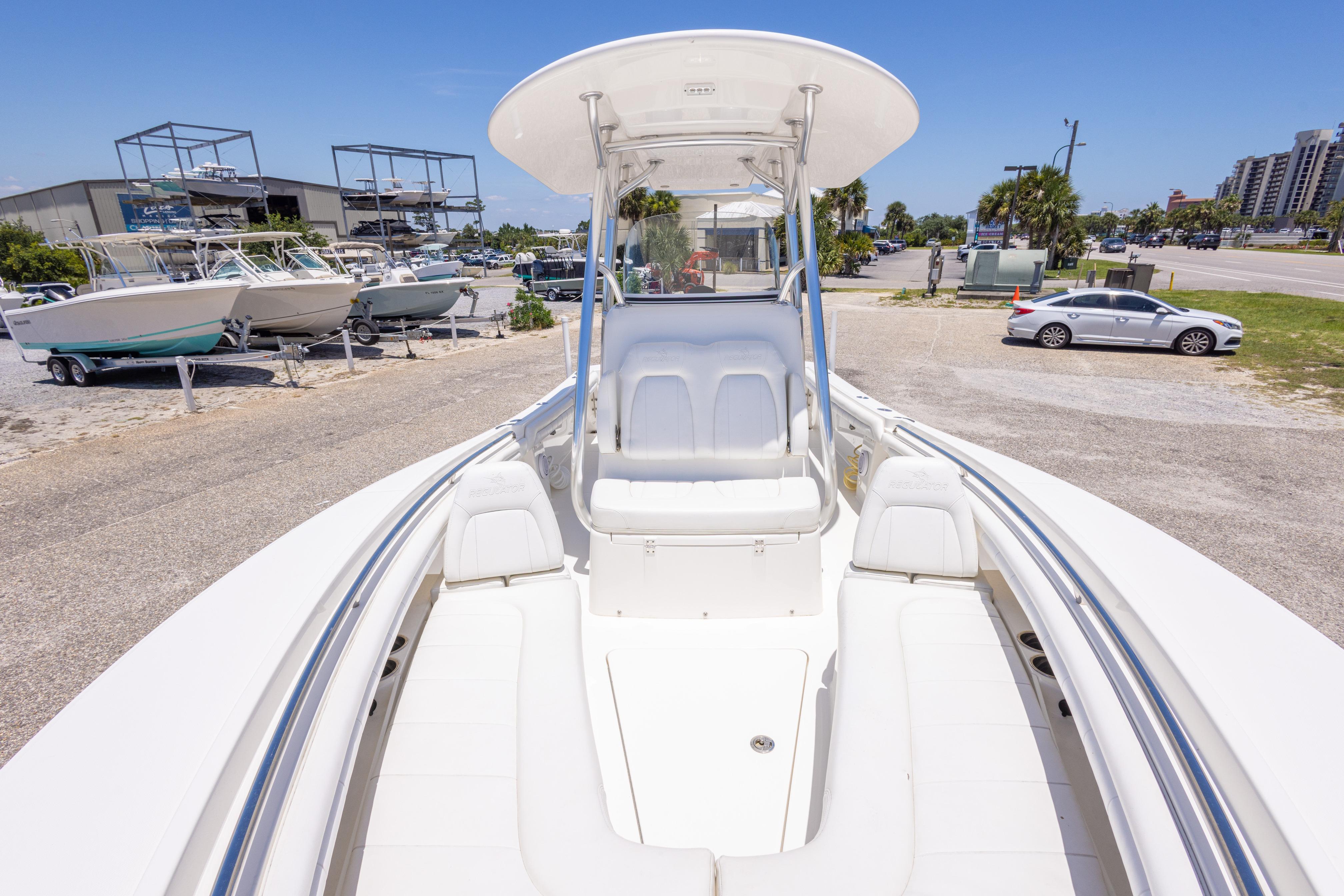 2019 Regulator 23 Center Console boat on display at a marina with other boats.