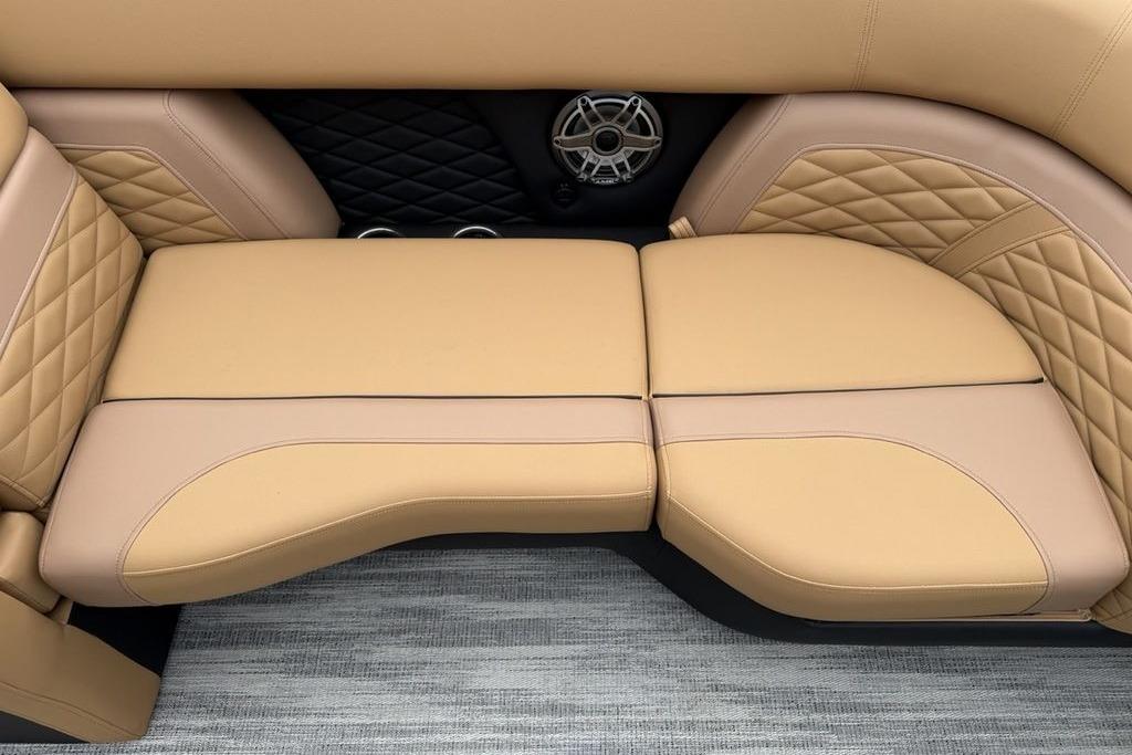 Luxurious tan seating in 2026 Godfrey Monaco 235 SFLC iMPACT boat interior.