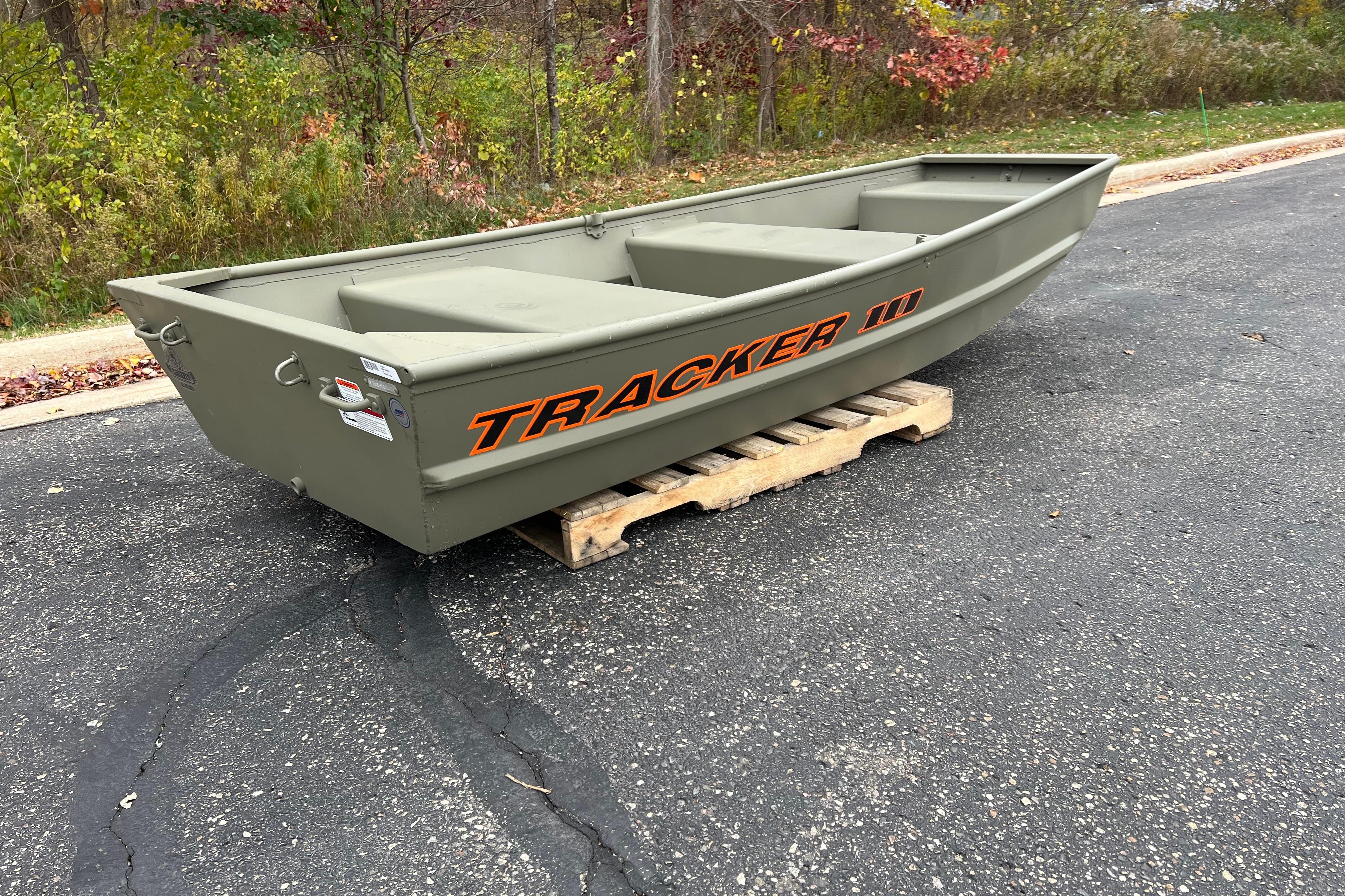 2026 Tracker Grizzly 10 Jon boat on a wooden pallet, outdoors.