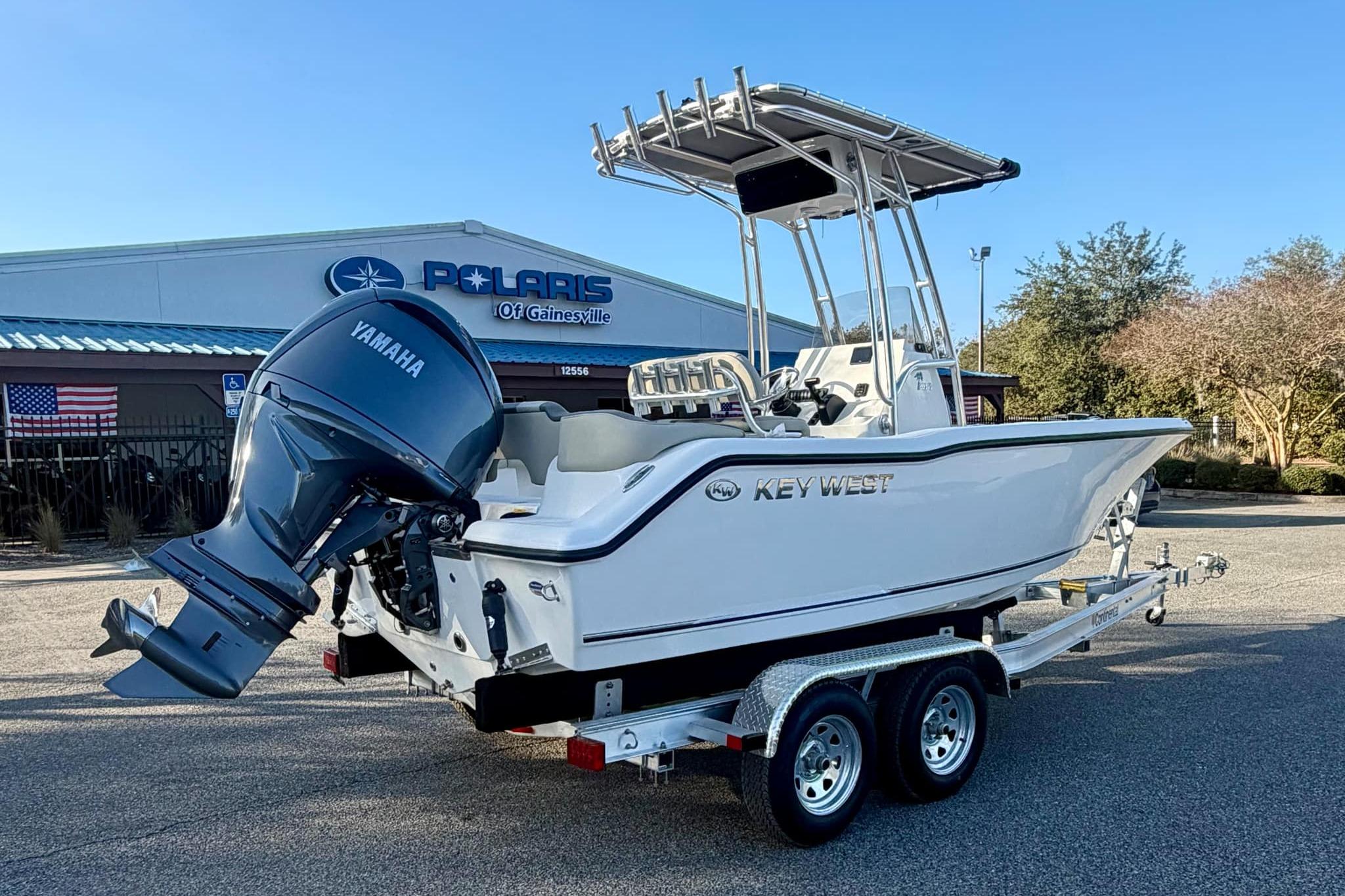2026 Key West 203 FS boat with Yamaha engine on trailer at dealership.