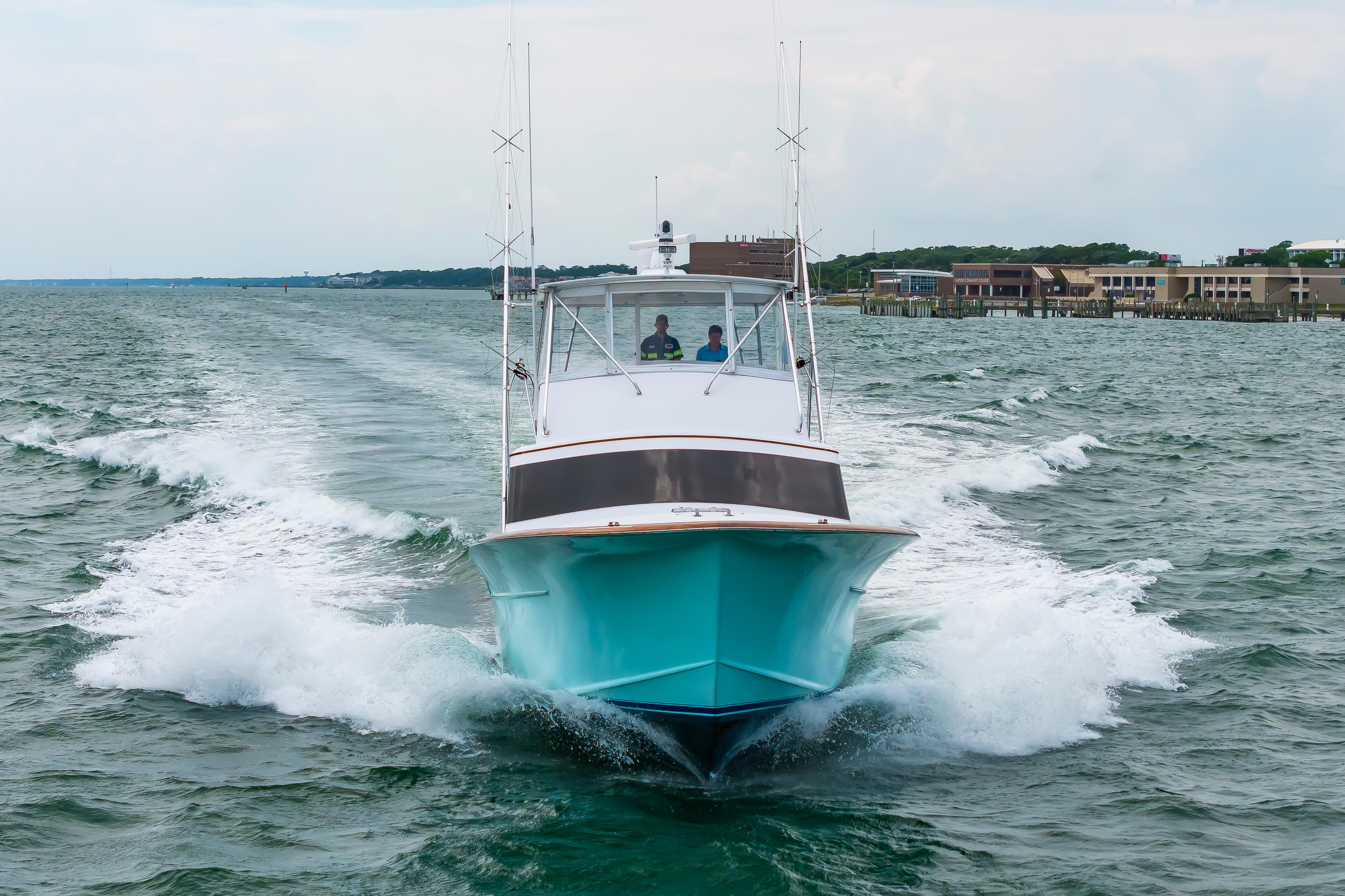 Custom Carolina Scarborough 56 Convertible yacht cruising on open water, 1993 model.