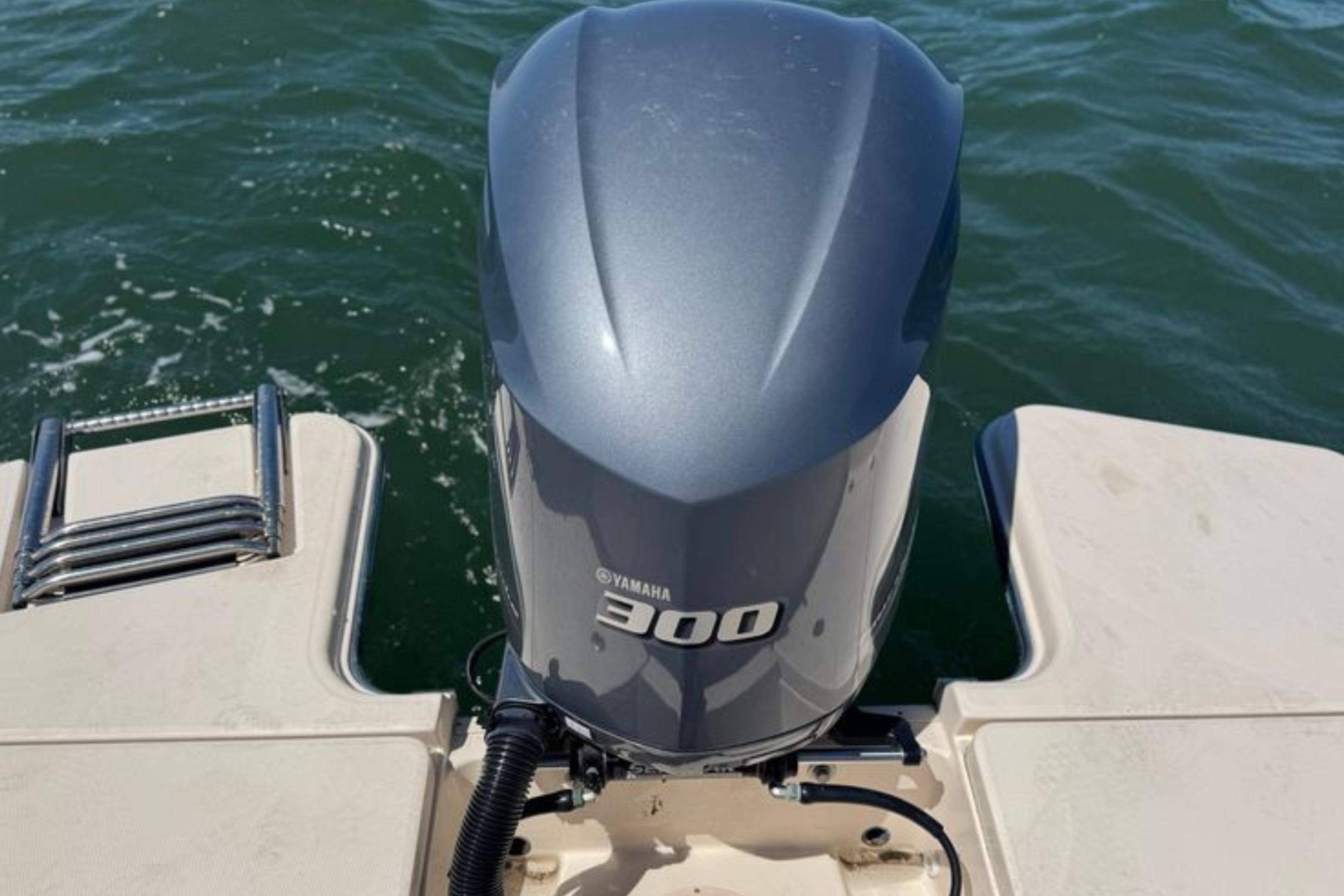 Yamaha 300 outboard motor on 2017 Grady-White Freedom 235 boat, ocean background.