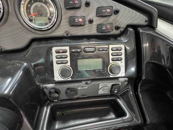 Dashboard of a 2014 Yamaha Boats 212X featuring a Clarion audio system.