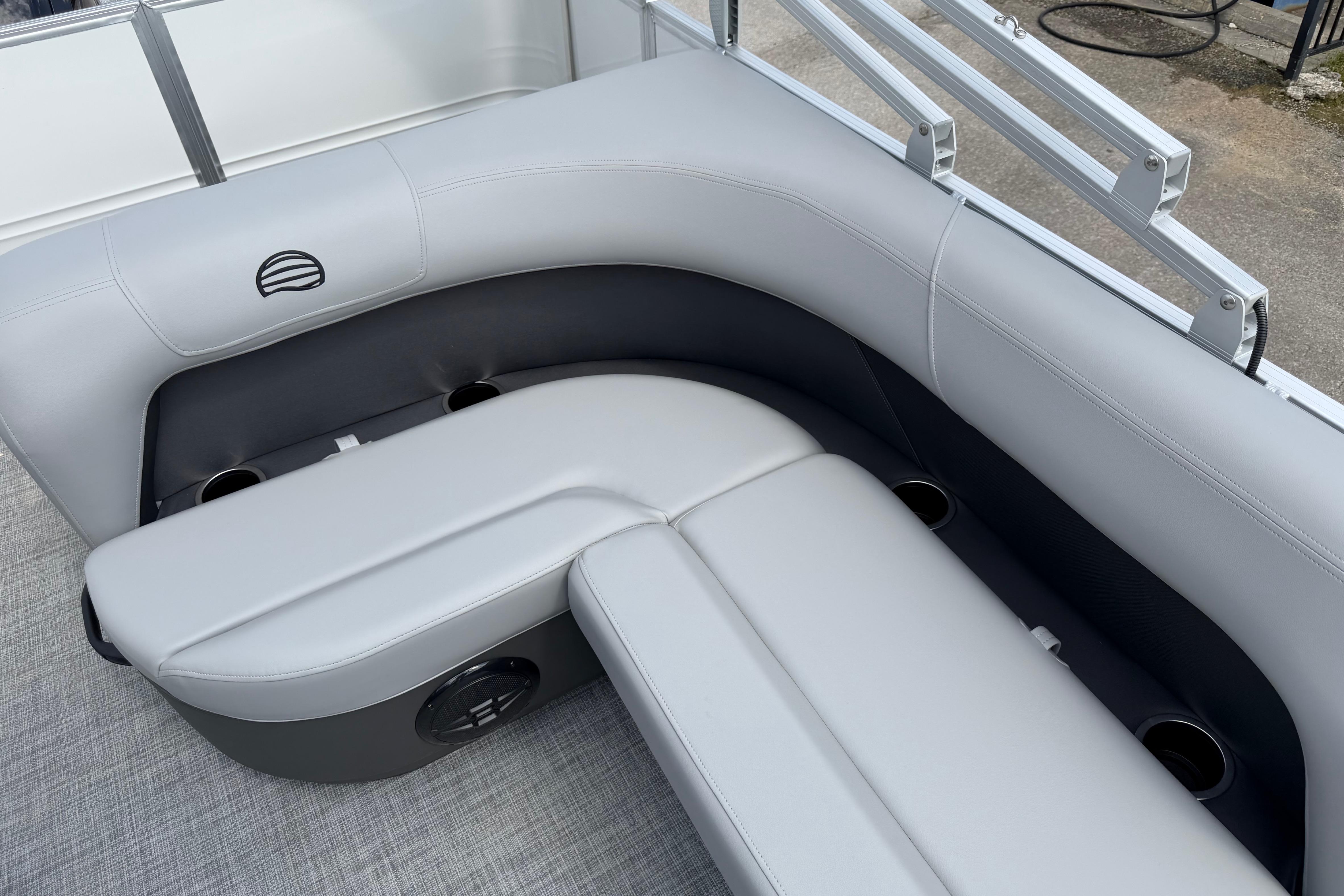 2026 Sun Tracker Party Barge 18 DLX interior seating with cup holders and sleek design.