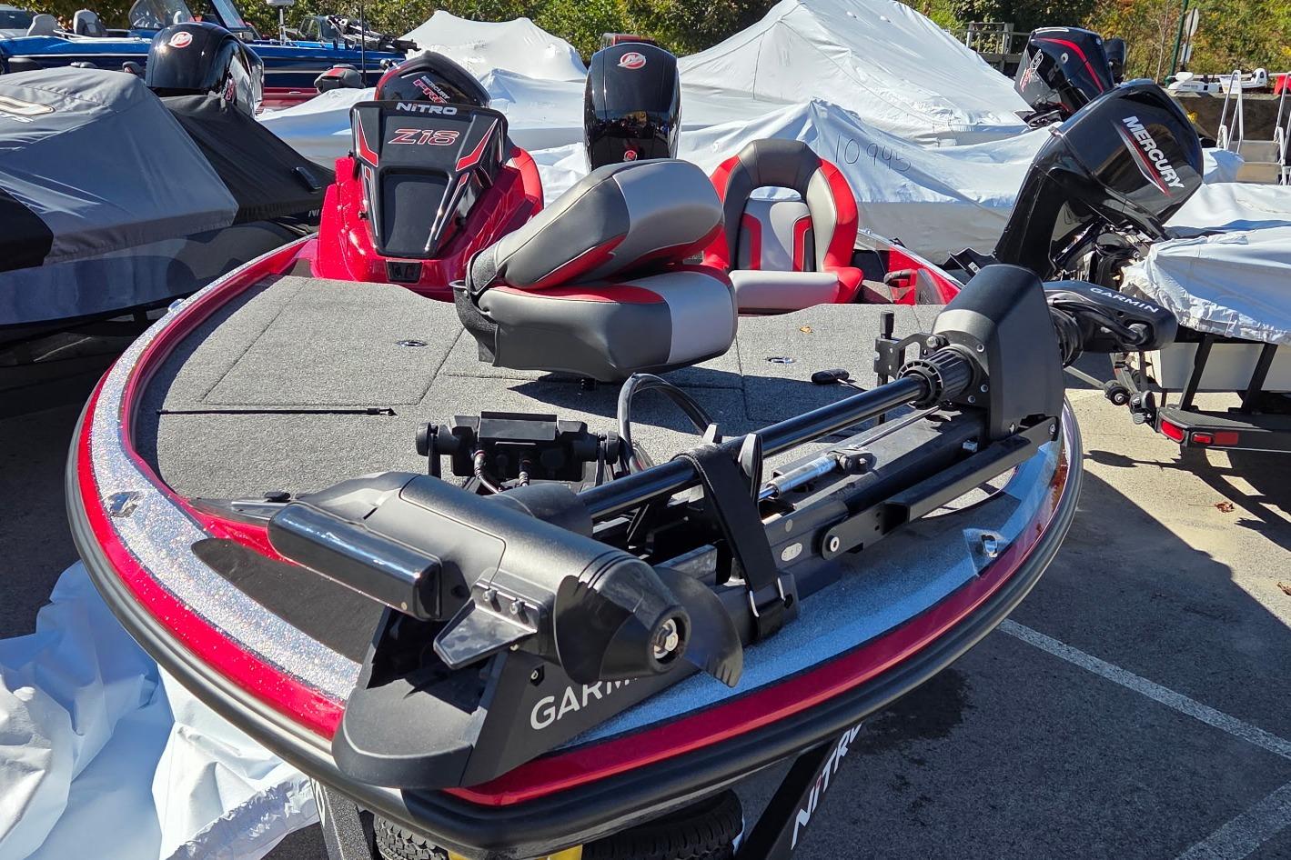 2026 Nitro Z18 Pro fishing boat with Garmin equipment and Mercury engine, parked outdoors.