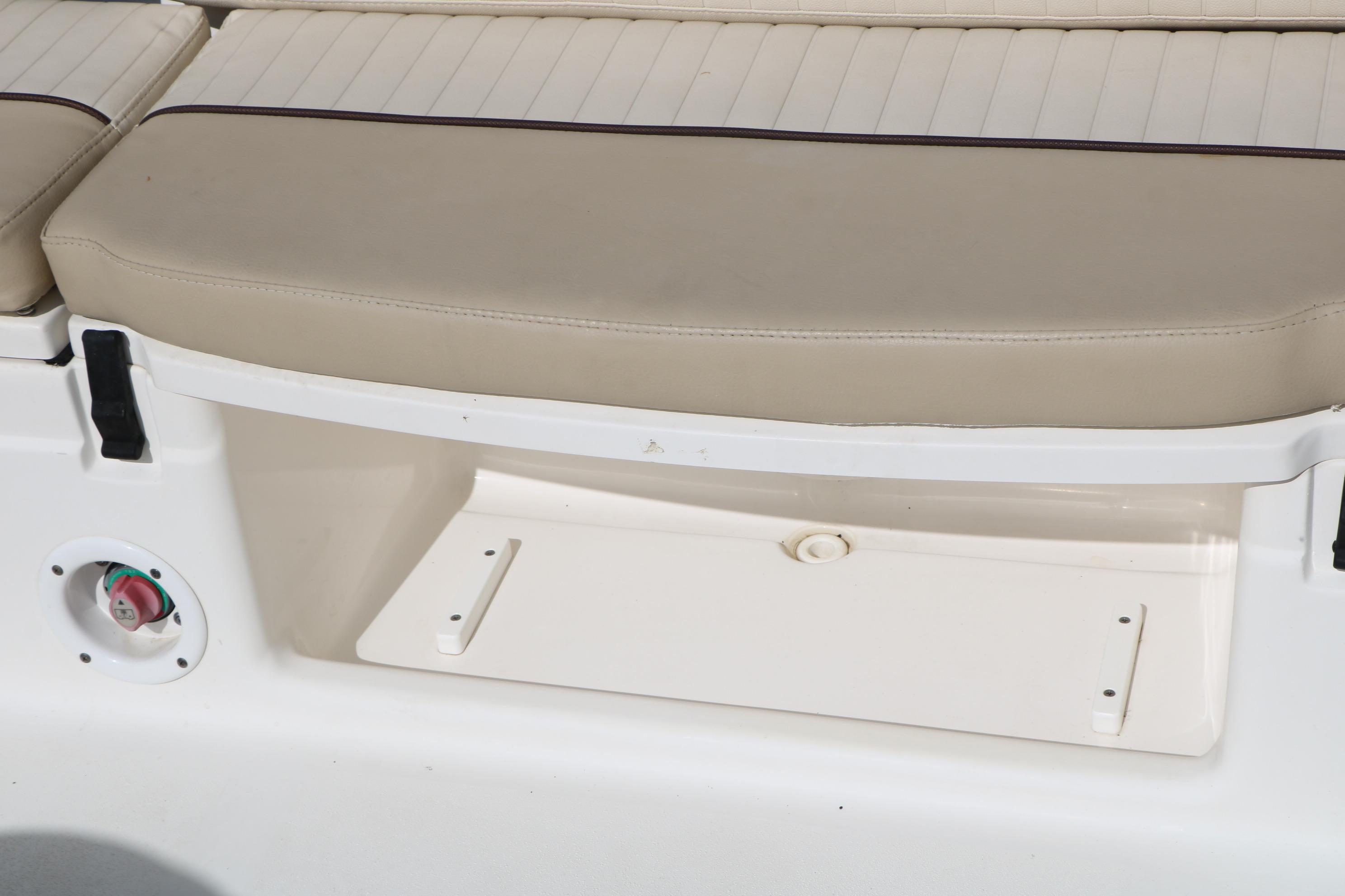 2017 Sea Fox 226 Traveler boat seat with beige cushion and storage compartment.