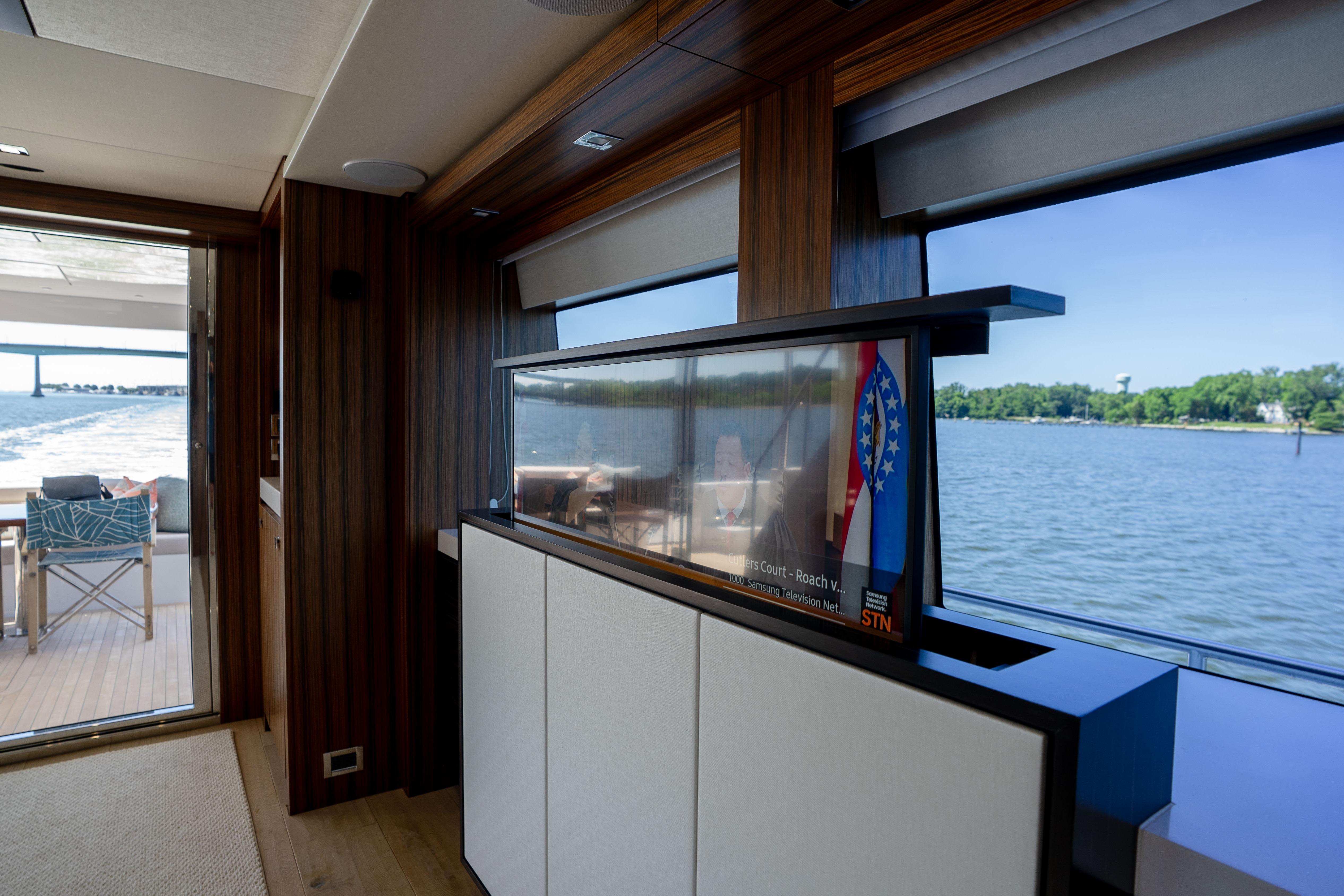 Luxurious interior of 2021 Hatteras M75 Panacera yacht with scenic water views.