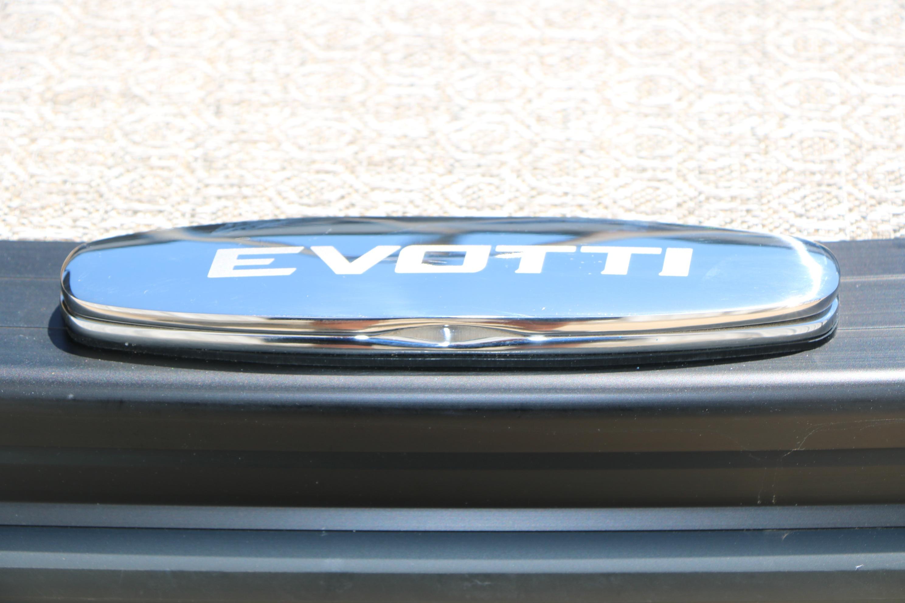 Chrome Evotti logo on 2026 Evotti 521CS vehicle, showcasing sleek design.