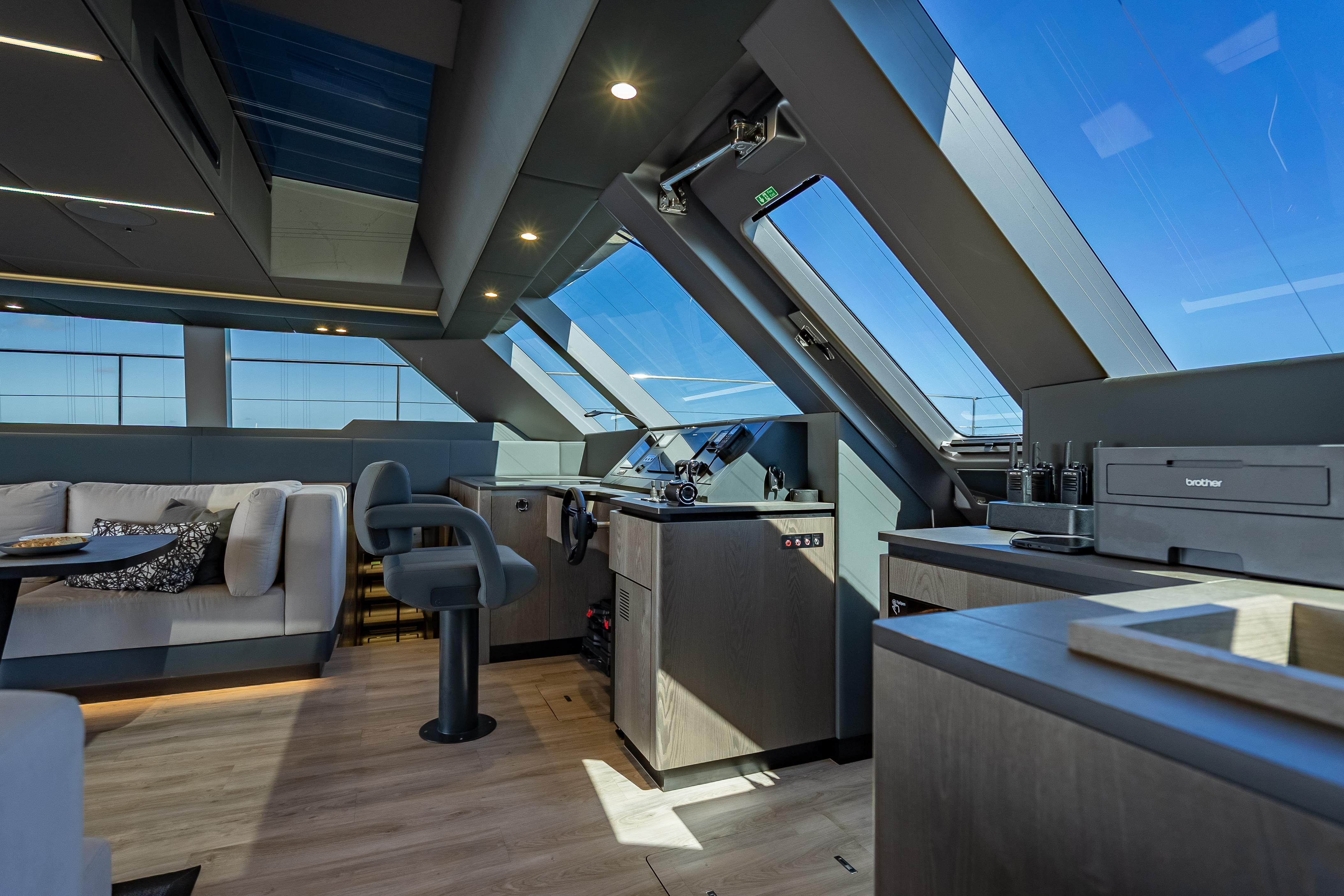 Luxurious interior of 2026 Sunreef 60 Power yacht with modern helm and seating area.