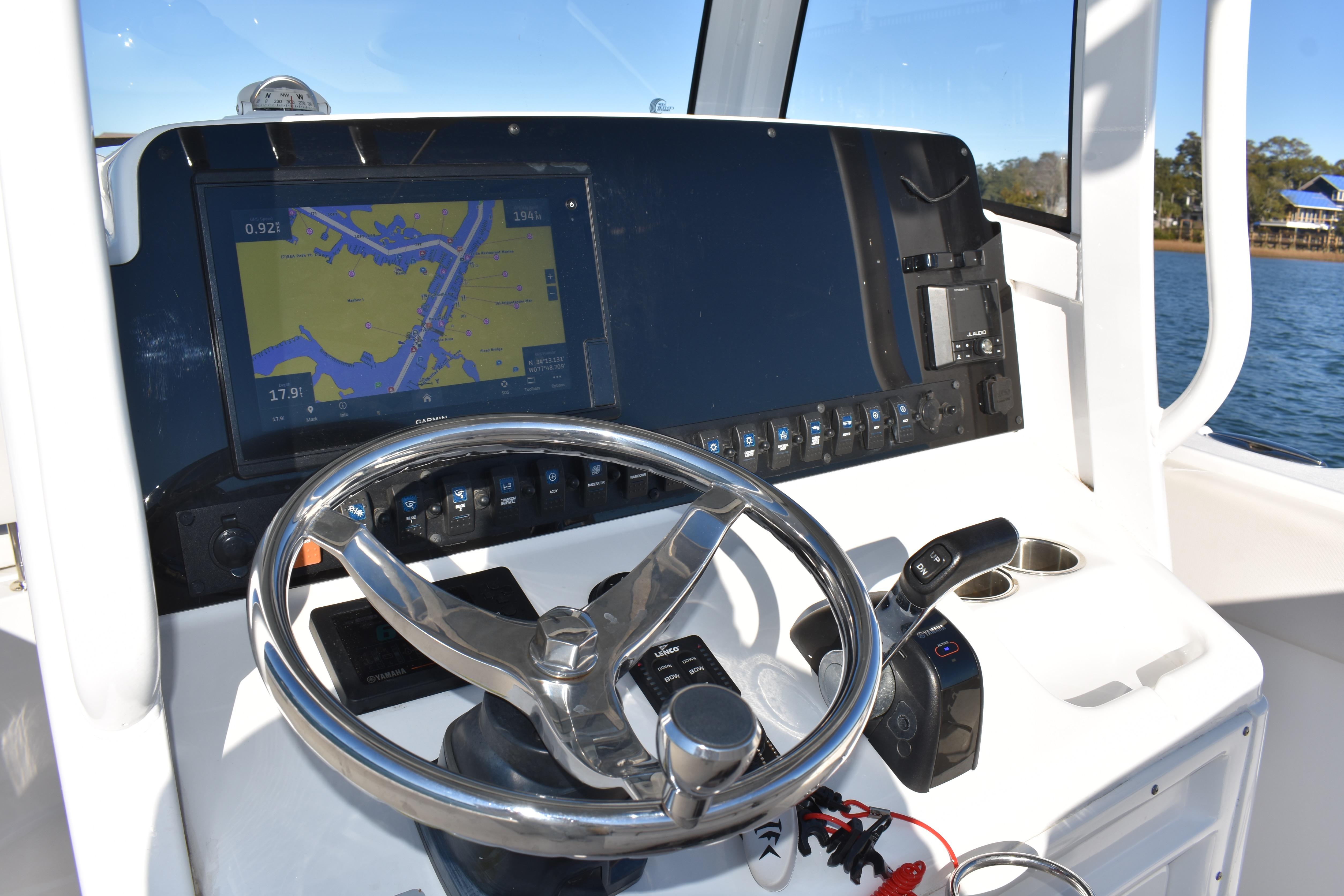 2020 Sea Hunt Ultra 255 SE helm with navigation display and steering wheel.
