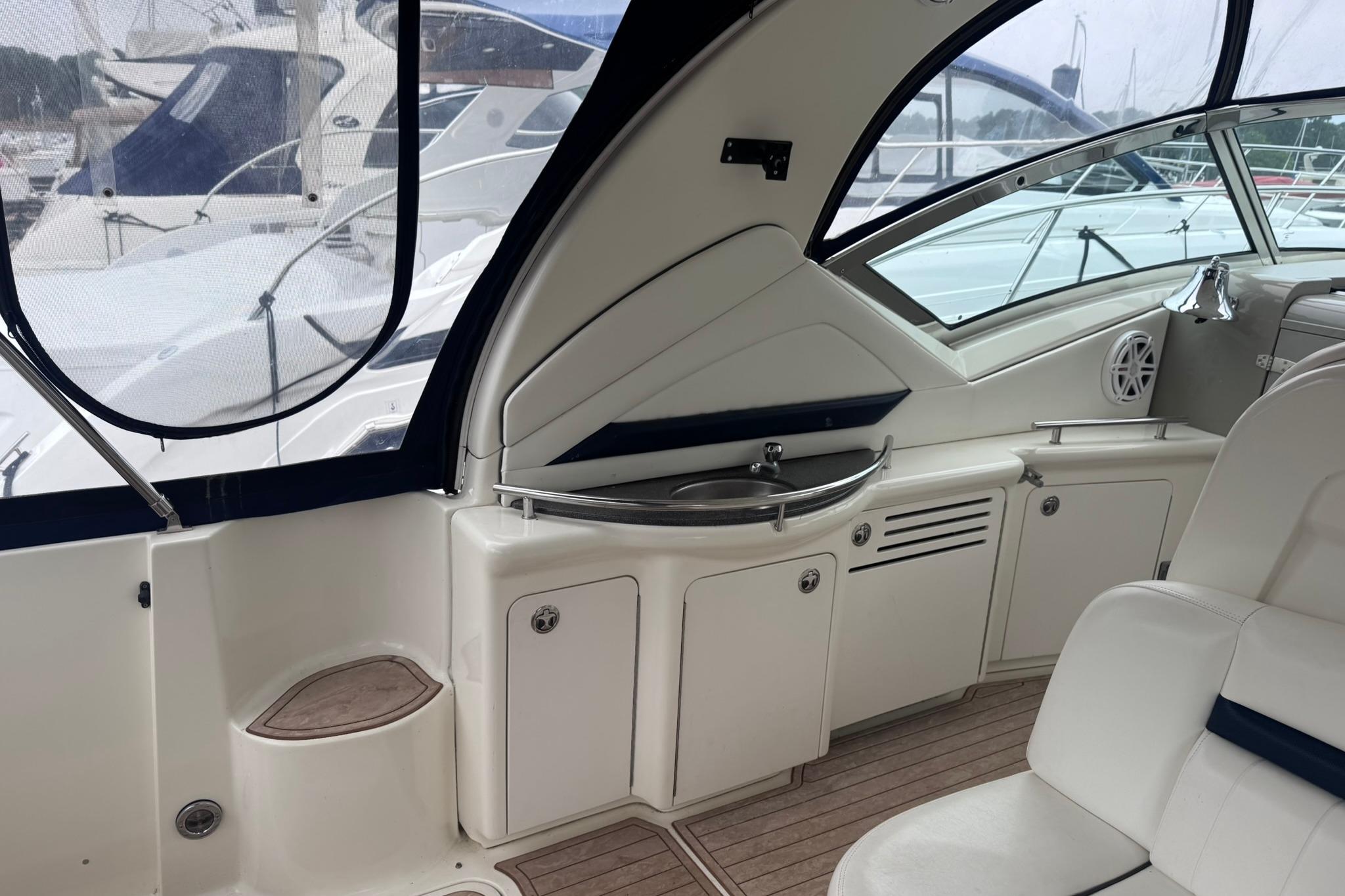 2004 Sea Ray 390 Sundancer yacht interior with sleek cabinetry and seating.