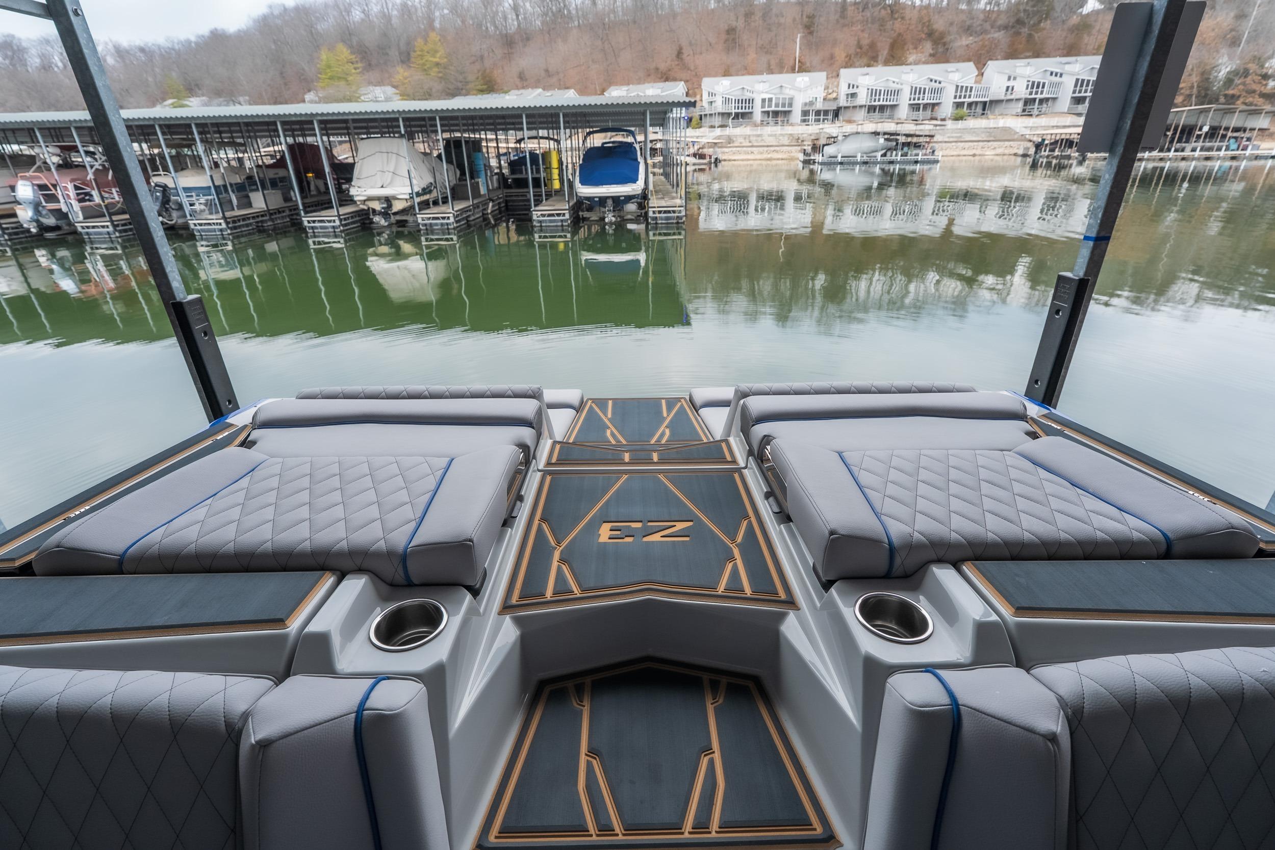 2026 Tigé Z3 boat interior with luxurious seating at a marina.