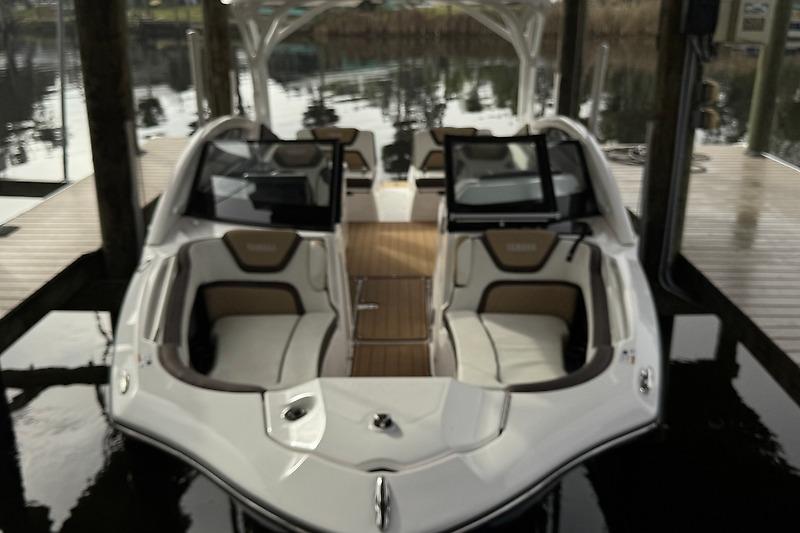 2023 Yamaha 275SDX boat interior with luxurious seating and sleek design.