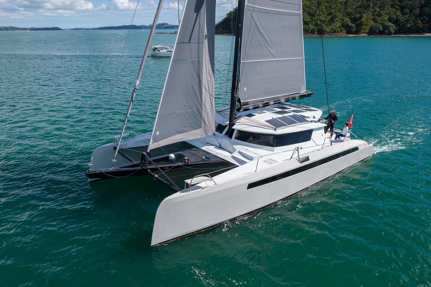 2014 Alibi 54 catamaran sailing on calm waters.