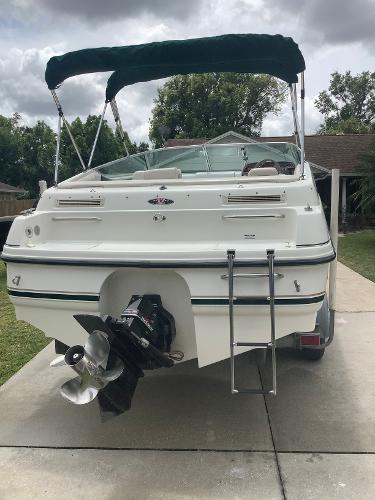 1998 Chaparral 2335 SS boat with green canopy, rear view.