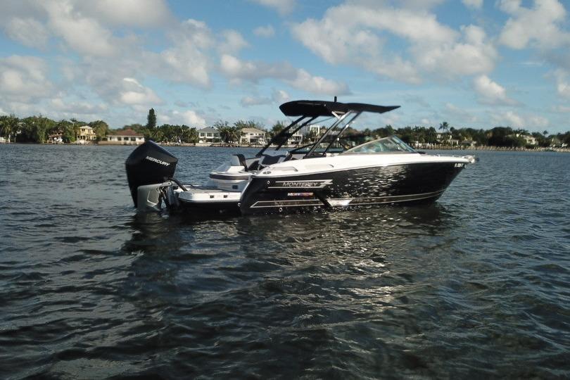 2022 Monterey 255SS Super Sport boat on calm water under a partly cloudy sky.
