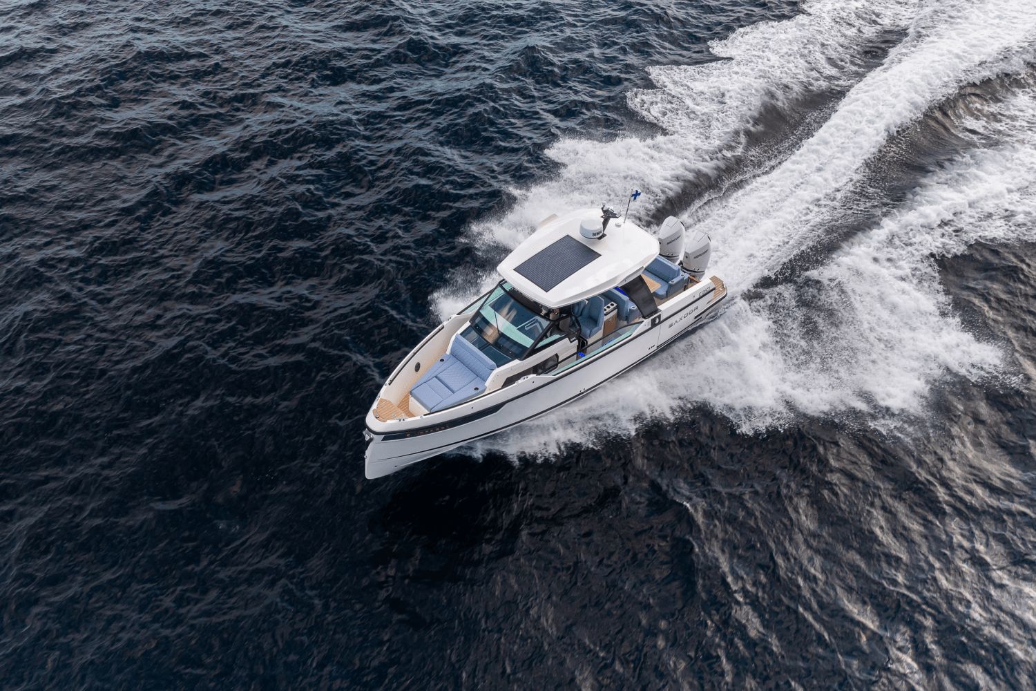 A 2027 Saxdor SX320 GTO speeds across the water, leaving a white wake behind.