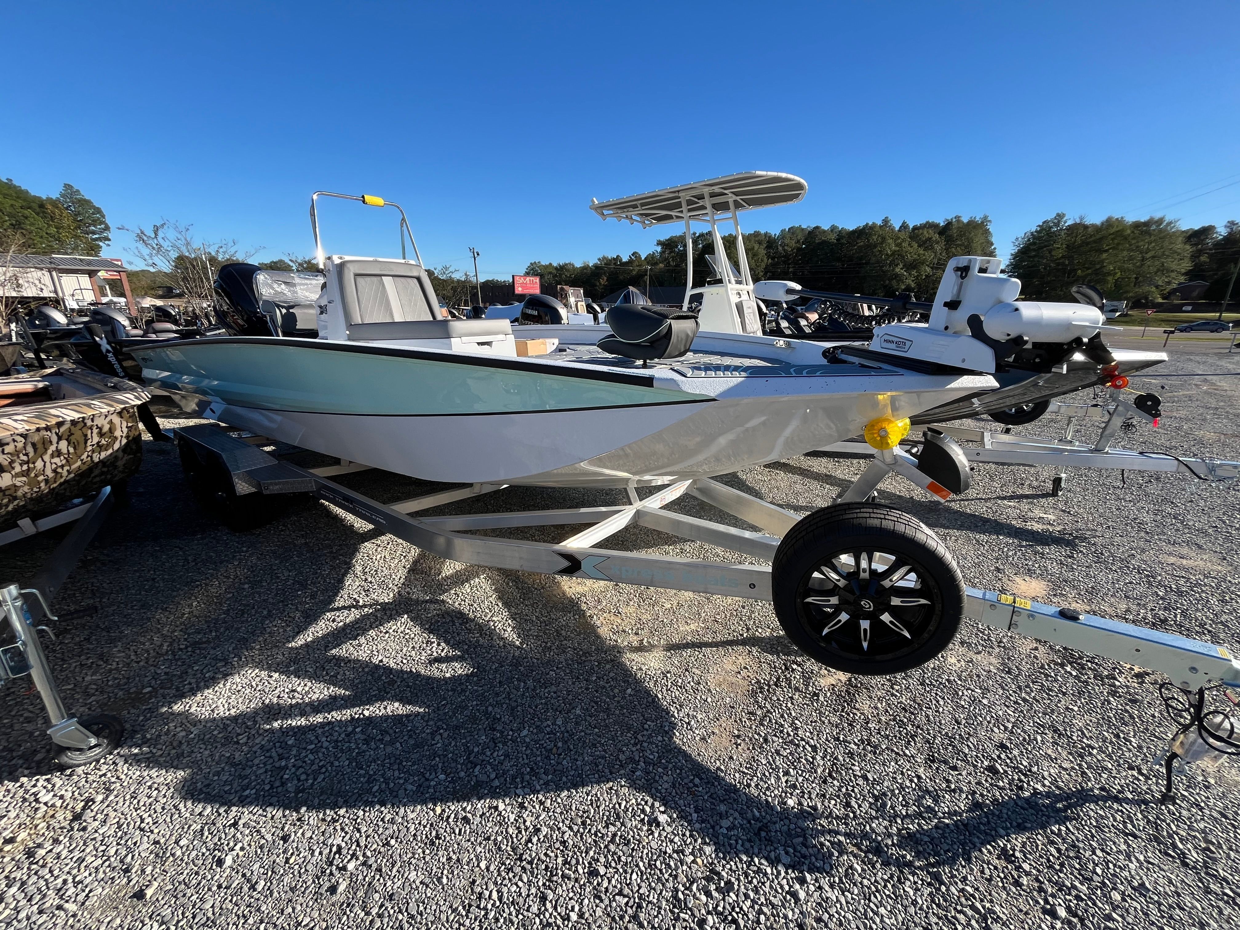 2024 Xpress X23B Bay Lounge boat on trailer.