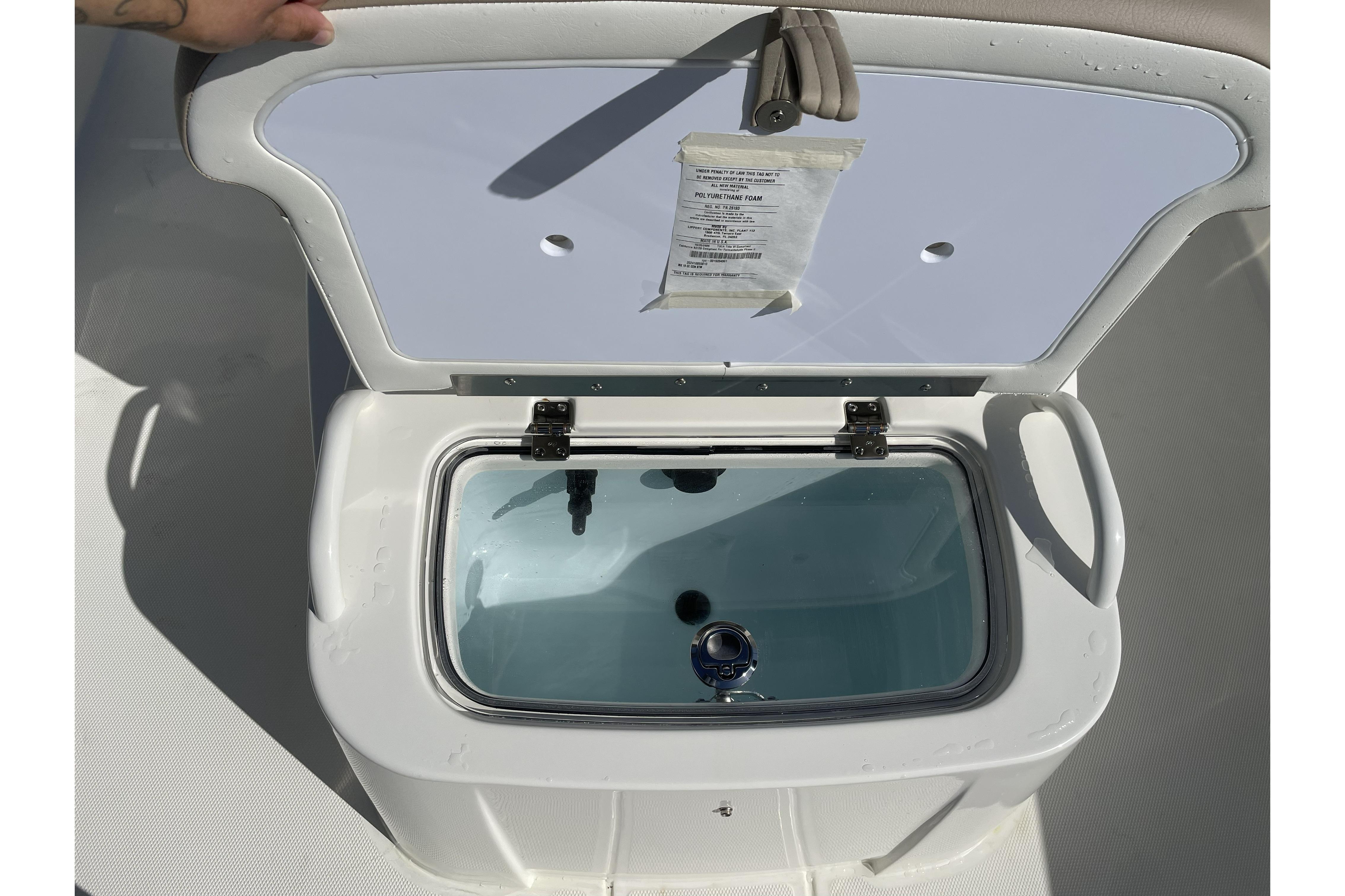 Open storage compartment on 2026 Mako Pro Skiff 19 CC boat.