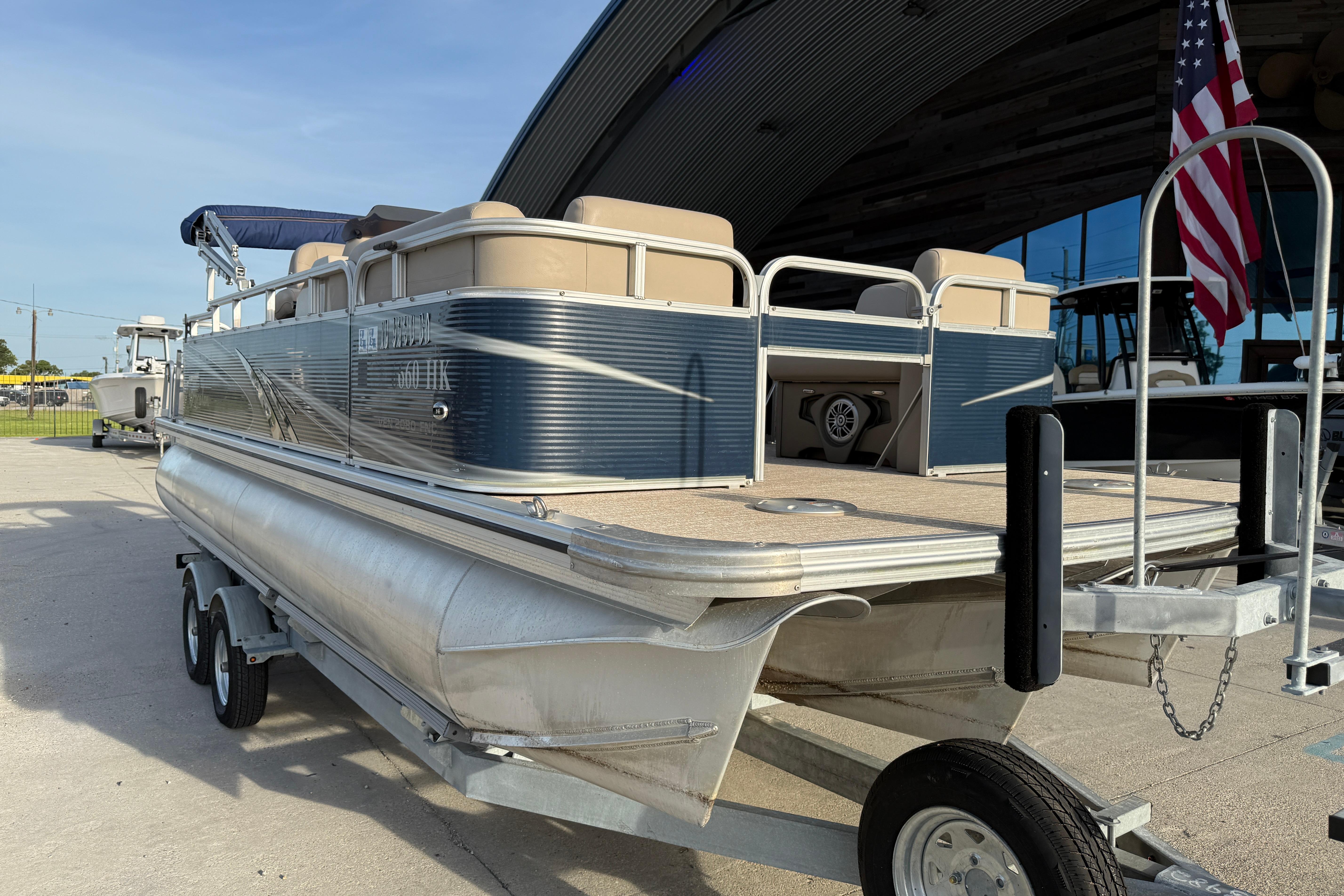 2019 Avalon Venture Fish N Cruise 20' pontoon boat on trailer, parked outdoors.