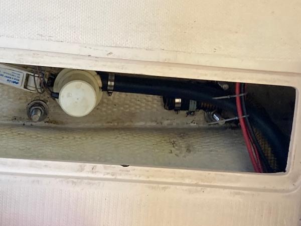 1989 Catalina 30 boat interior showing plumbing and wiring components.