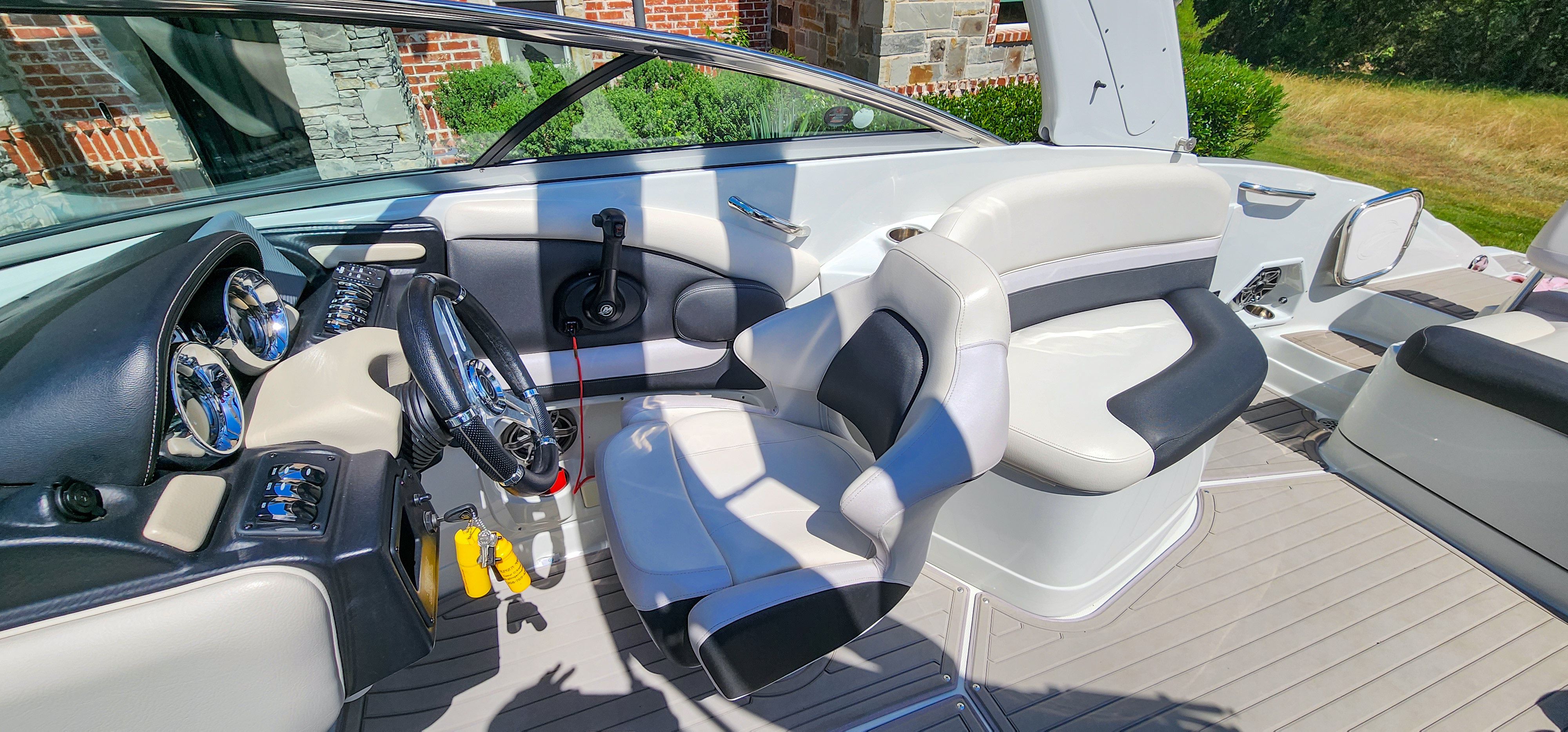 Interior of a 2017 Crownline 285SS boat with sleek seating and modern helm console.