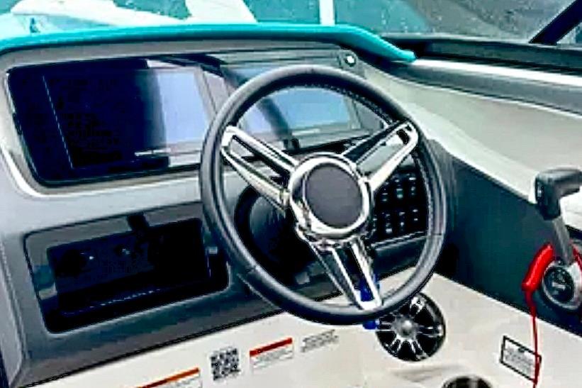 2020 Regal LS6 boat dashboard with steering wheel and control panel.