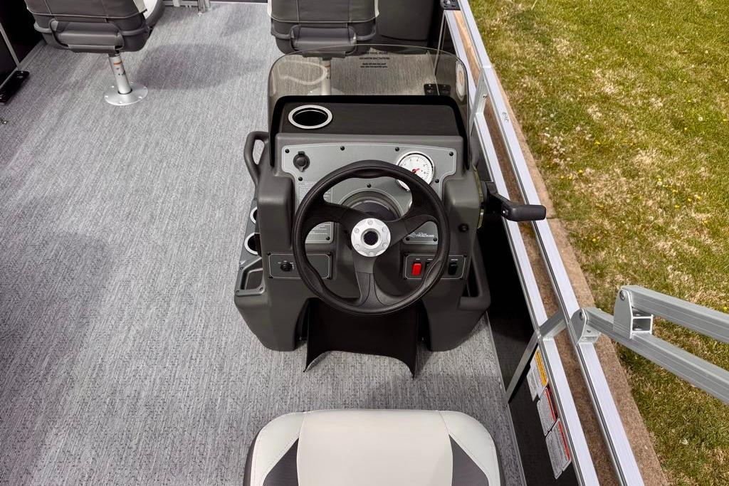 Steering console of 2026 Sun Tracker Bass Buggy 18 DLX pontoon boat.