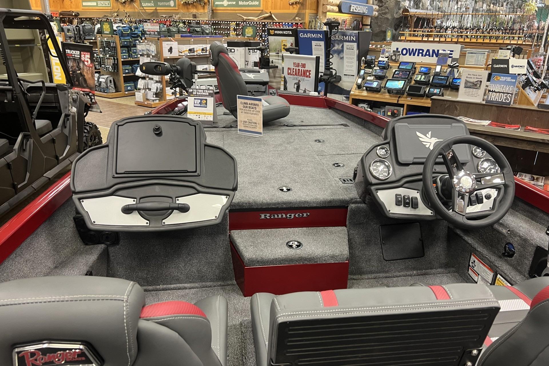 2026 Ranger RT198P boat interior with steering wheel and control panel in showroom.