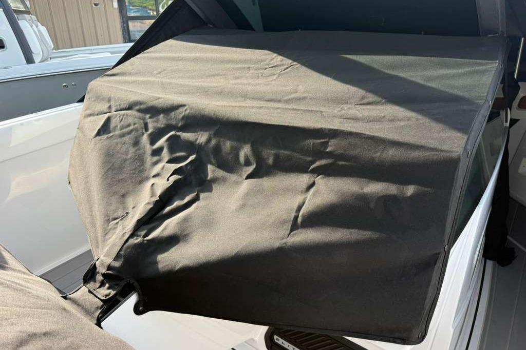 Protective cover on a 2026 Monterey Elite 30 OB boat, showcasing interior protection.