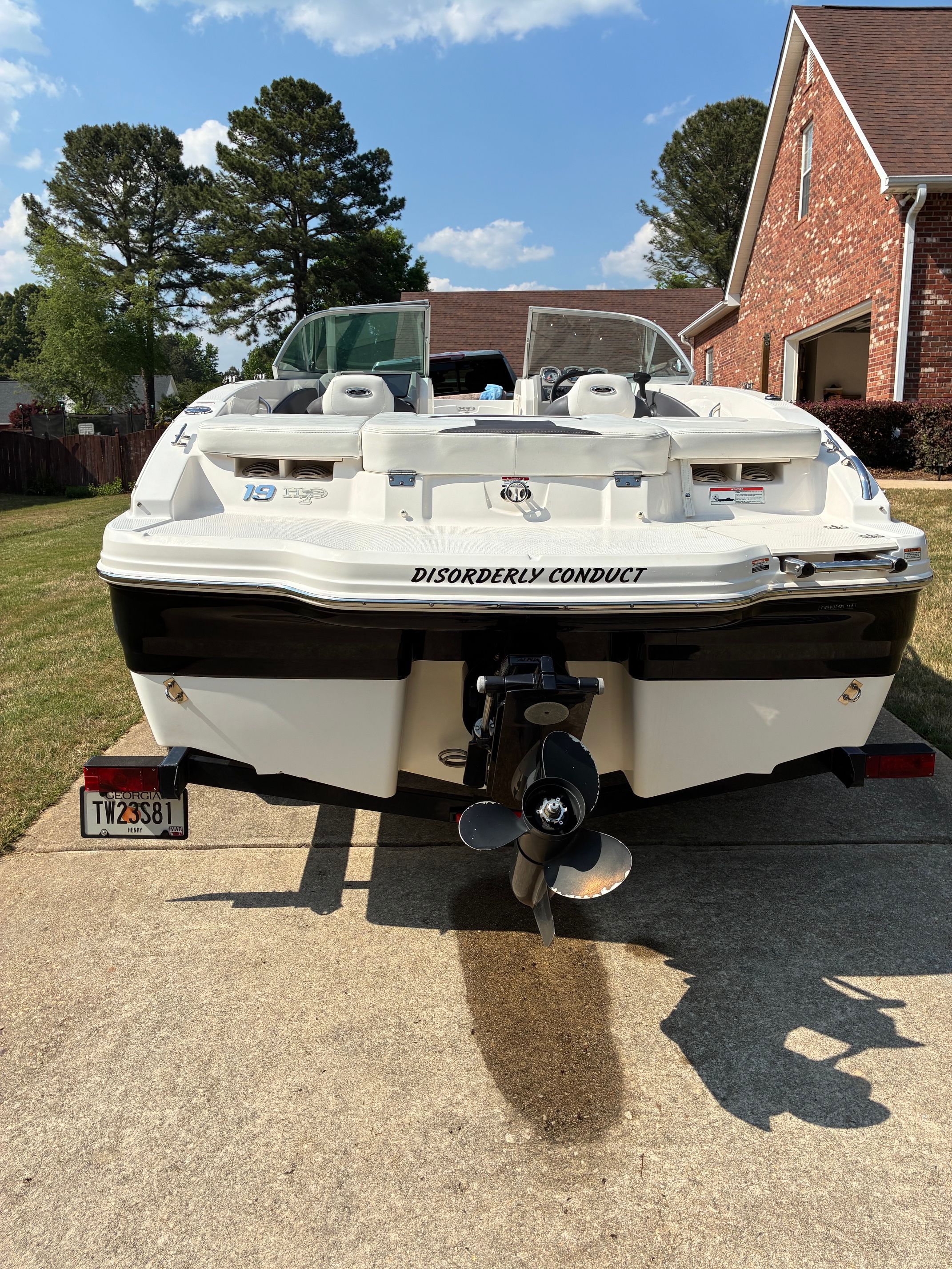 Chaparral 19 H2O Sport 2012 on a trailer in a driveway.