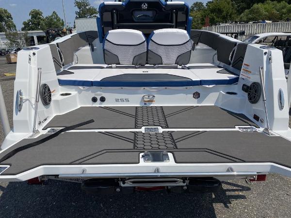 2021 Scarab 255 Open ID boat, rear view, showcasing spacious deck and seating.