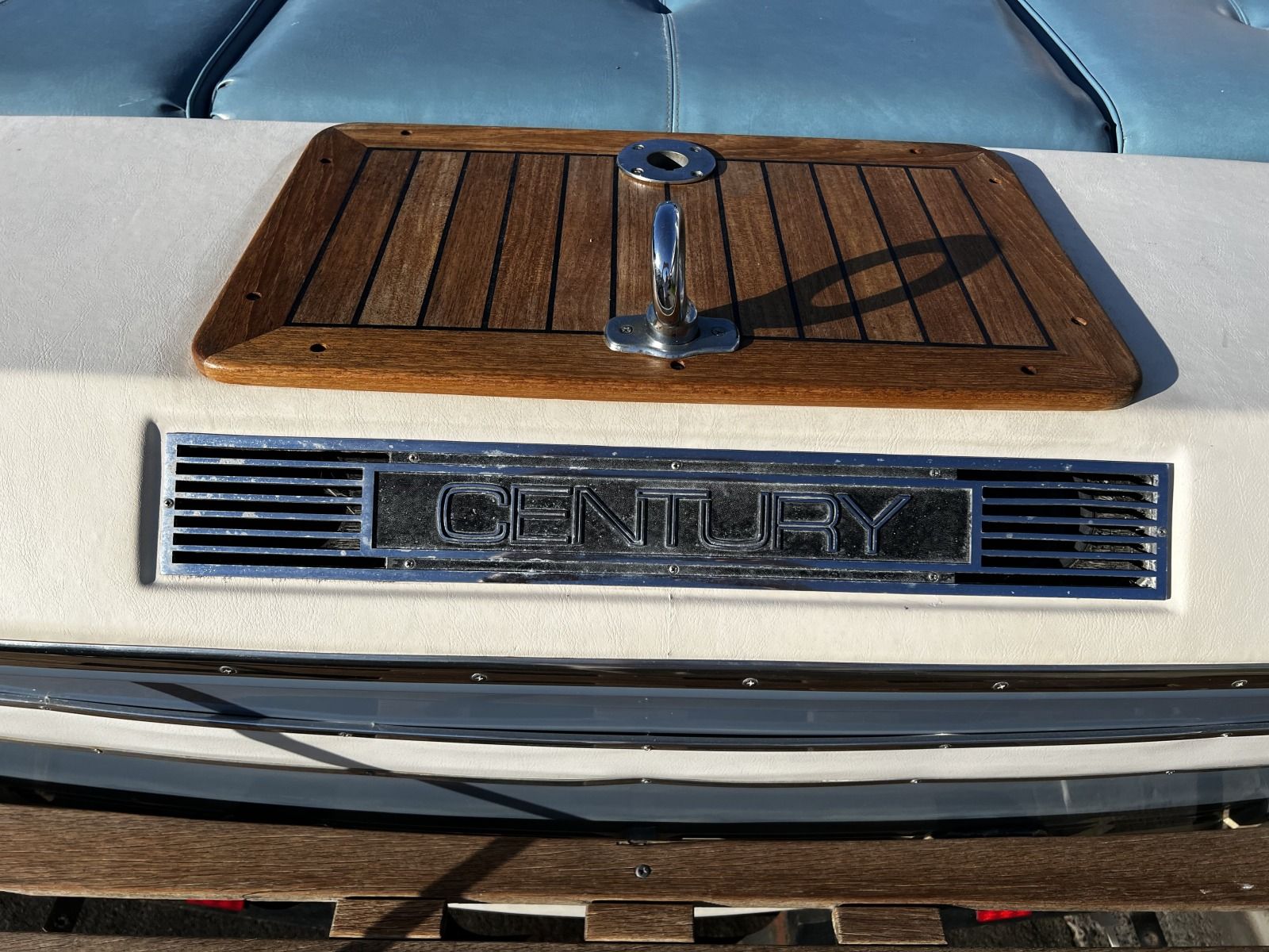 1985 Century Coronado Cardel boat with wood accents and chrome logo.