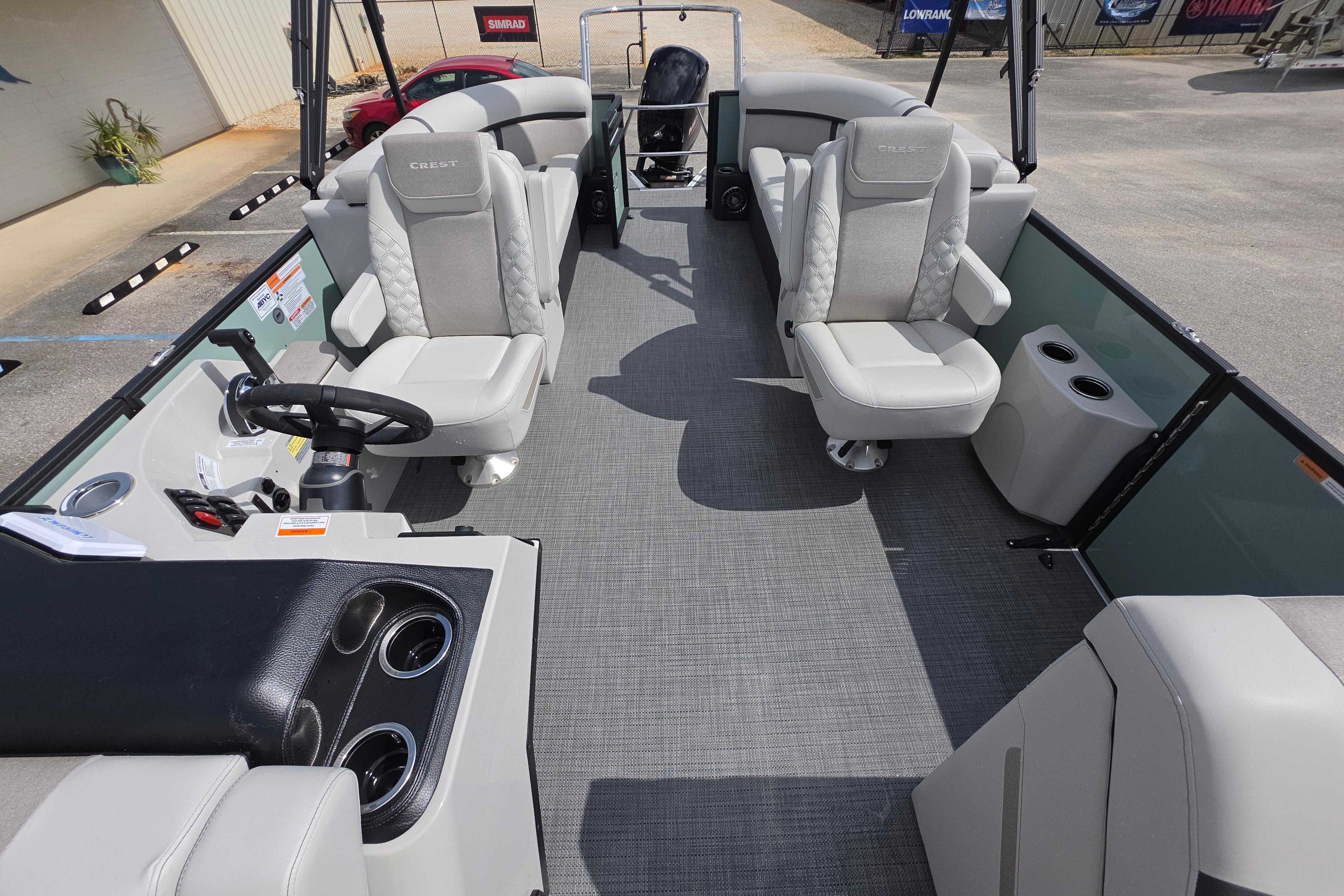 Interior of 2026 Crest 235 Conquest SLC boat with modern seating and steering console.