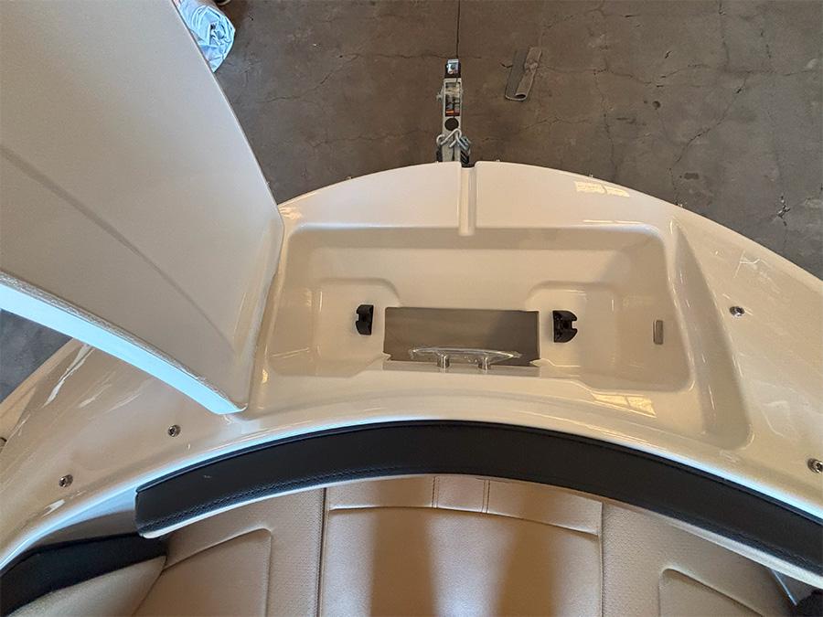 2025 Sea Ray SPX 190 Outboard boat interior, featuring storage compartment and seating.