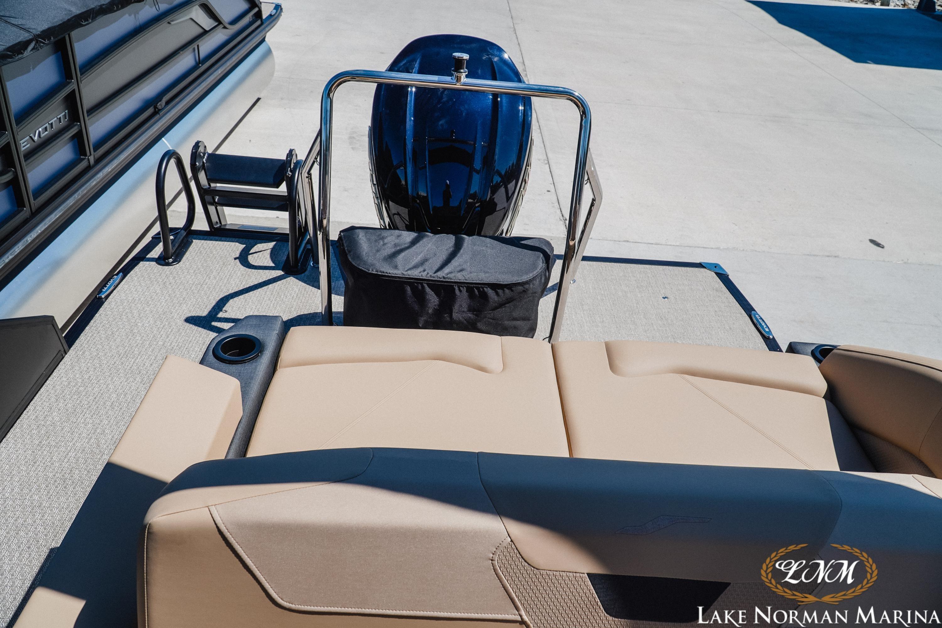 Evotti 523CS 2026 boat interior with beige seating at Lake Norman Marina.