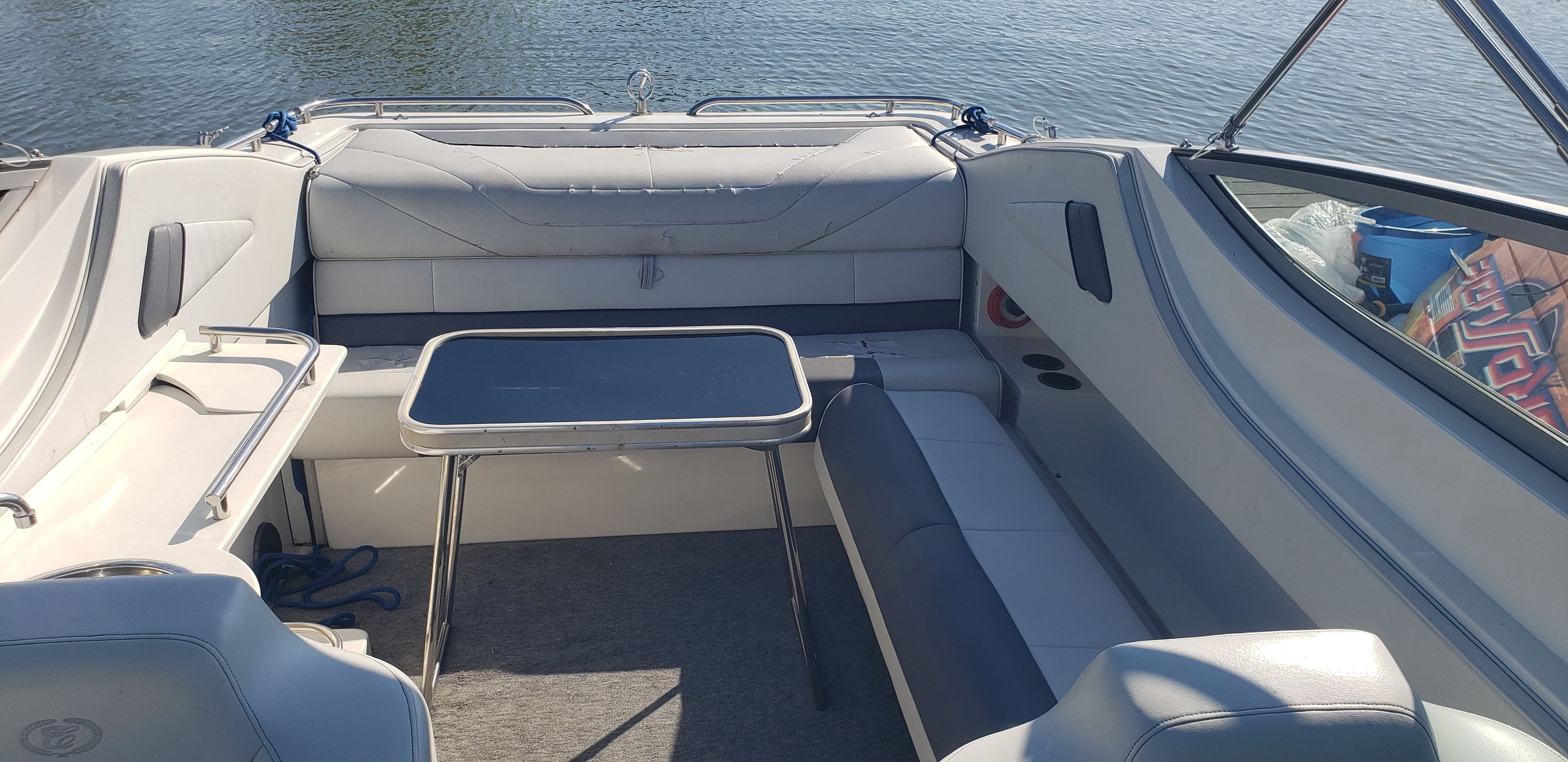 Interior of a 1993 Cobalt 272 boat with seating area and table.