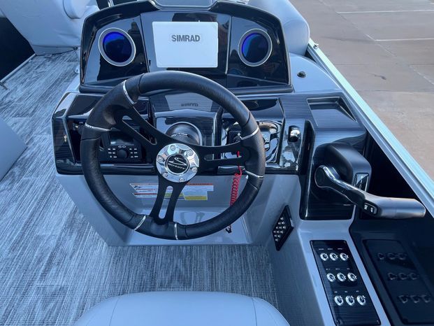 2025 Landau Atlantis 23C Cruise helm with Simrad system.