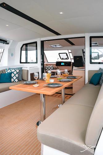 2025 Nautitech 40 Open yacht interior with elegant dining setup and modern design.