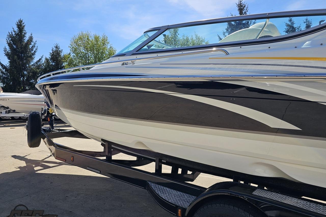 2014 Formula 292 FASTech boat on trailer, sleek design, parked outdoors.