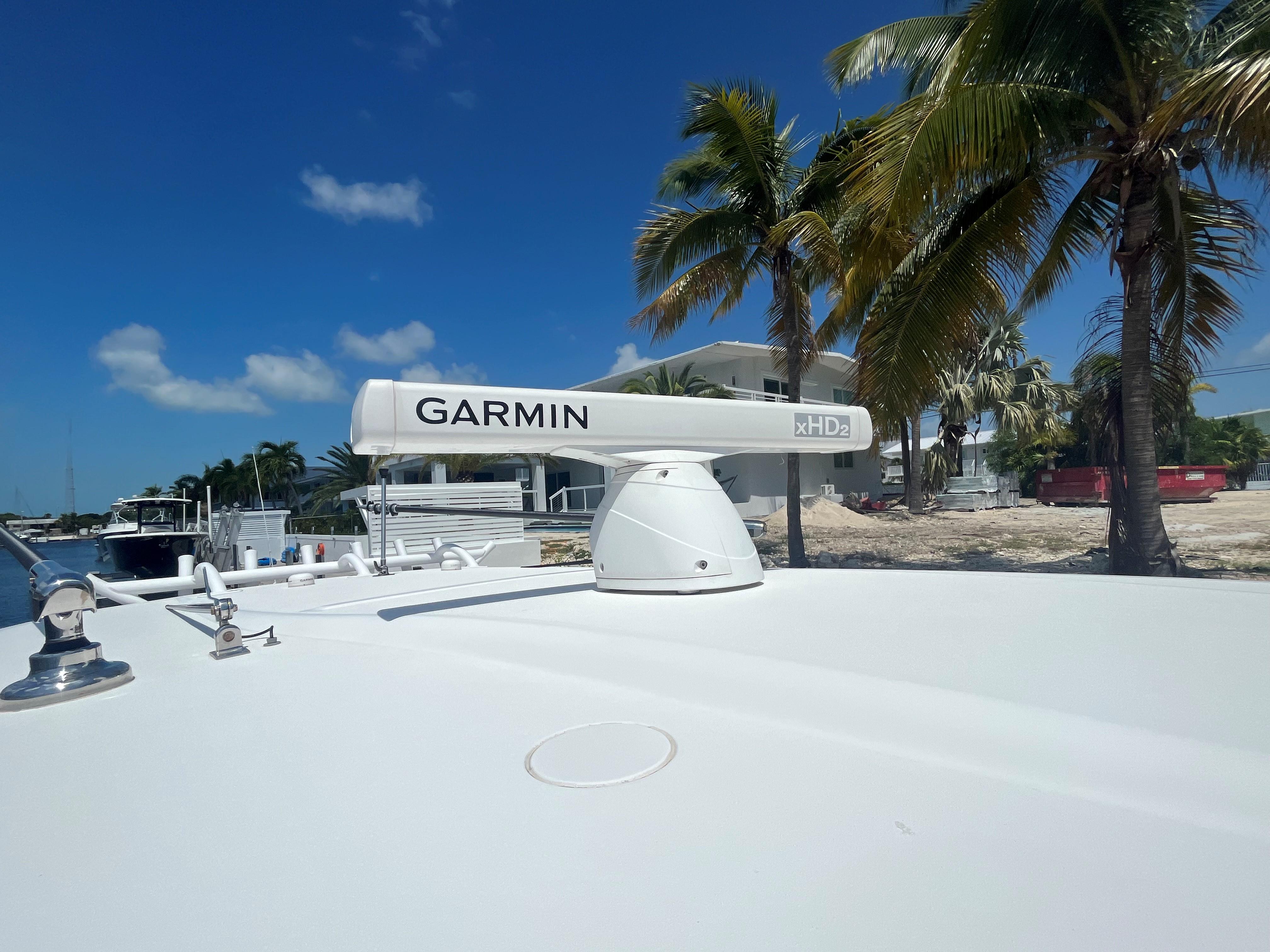 Garmin radar on 2018 Blackwater 43 boat, with palm trees and blue sky background.