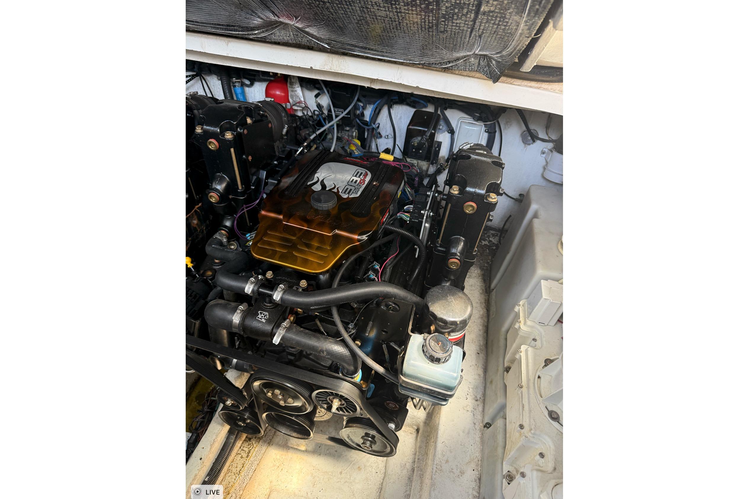 Engine compartment of a 2006 Sea Ray 300 Sundancer boat, showcasing detailed mechanics.