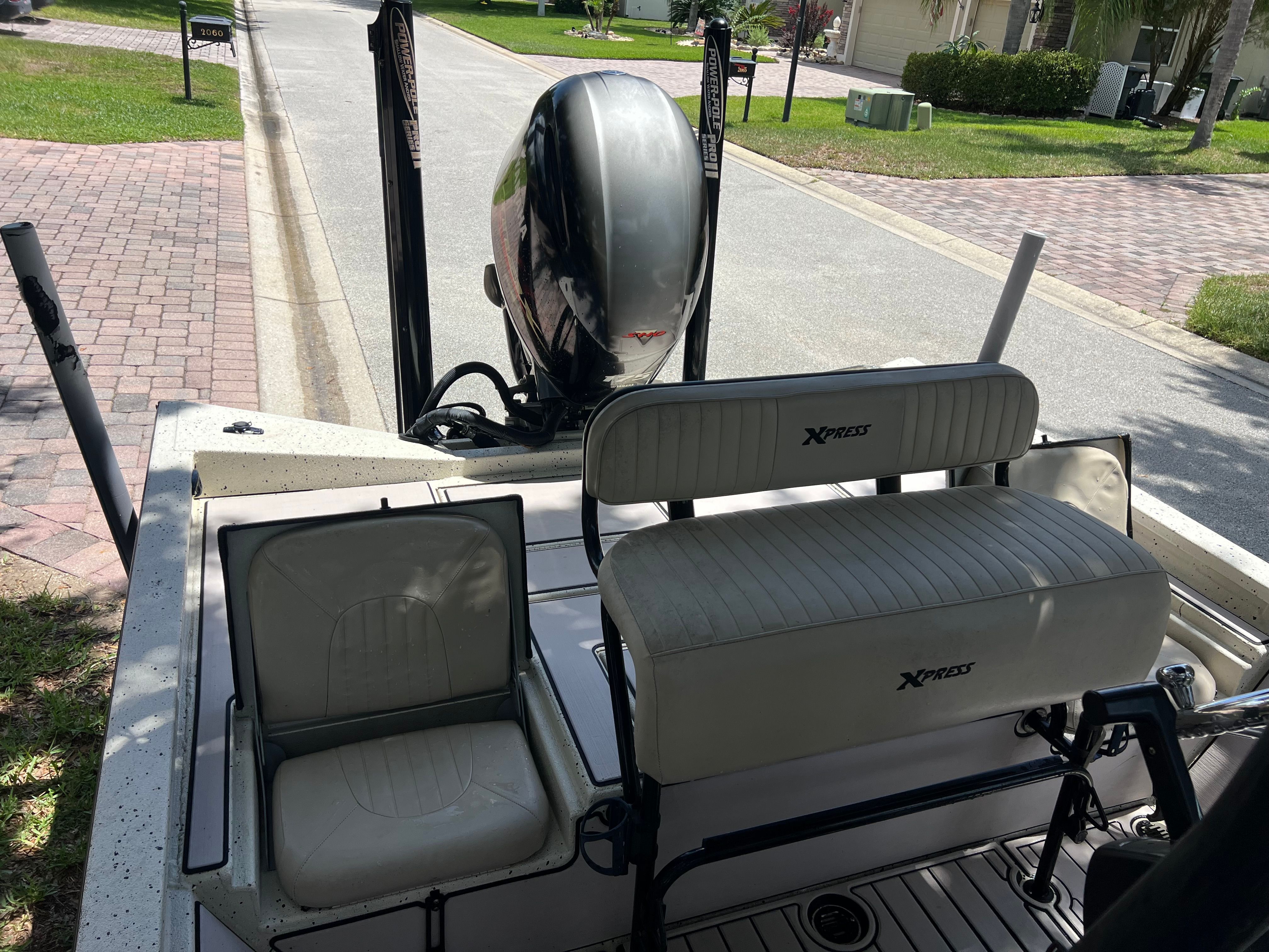 2016 Xpress H24B Bay boat with seating and motor.