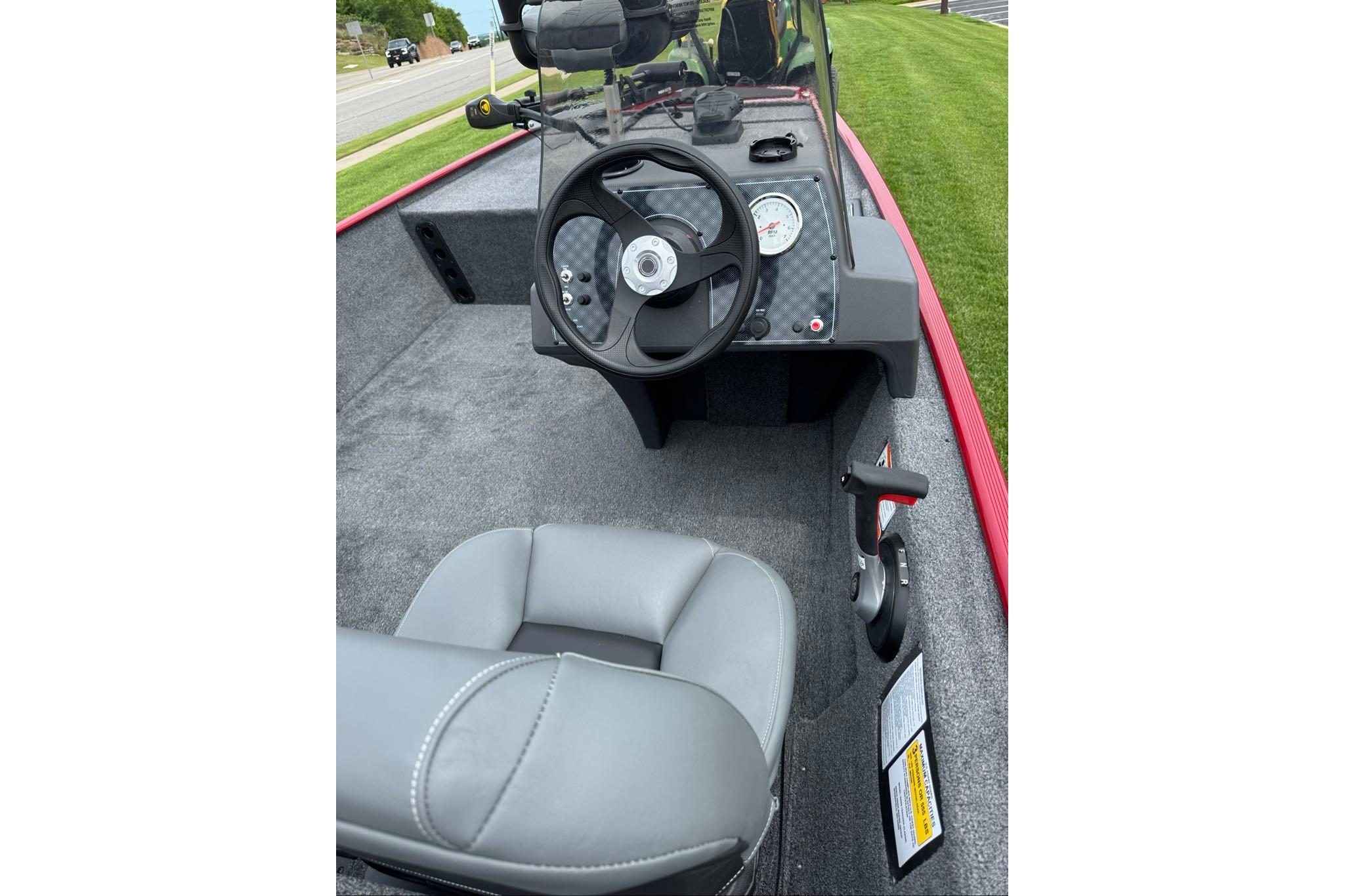 2026 Tracker Bass Tracker Classic XL boat interior with steering wheel and gray seating.
