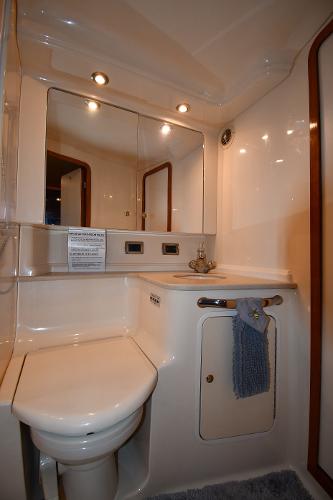 2003 Sea Ray 460 Sundancer bathroom with modern fixtures and lighting.