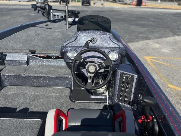 Interior of a 2025 Phoenix 920 Elite boat, featuring a sleek steering console.